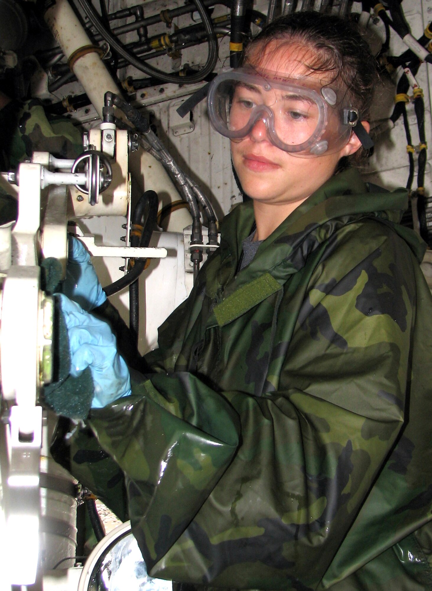 Senior Airman Jessica Wrestler scrubs the inside of a B-2 Spirit landing gear well at Andersen Air Force Base, Guam, on Aug. 11. Airmen from the 36th Expeditionary Aircraft Maintenance Squadron and 13th Expeditionary Bomb Squadron took part in the wash. A full wash of the aircraft is required every 30 days. It takes approximately 24 hours to wash a B-2, and a special concentration of soap is used, different from any other aircraft. Airman Wrestler is with the 36th EAMXS. (U.S. Air Force photo/Tech. Sgt. Mikal Canfield)
