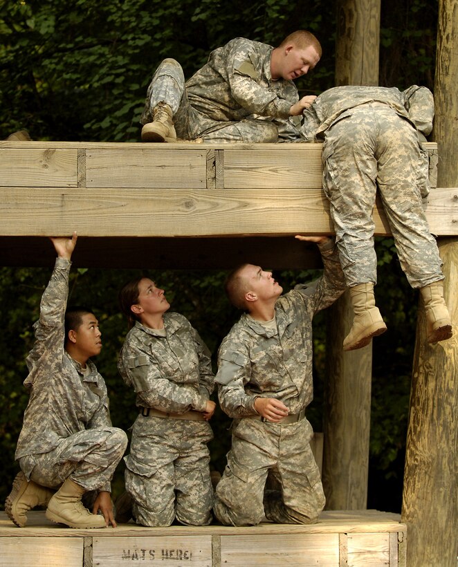U.S. Army recruits help each other complete the platform obstacle portion of the confidence course during basic combat training at Fort Jackson, S.C., Aug. 8, 2006. 
