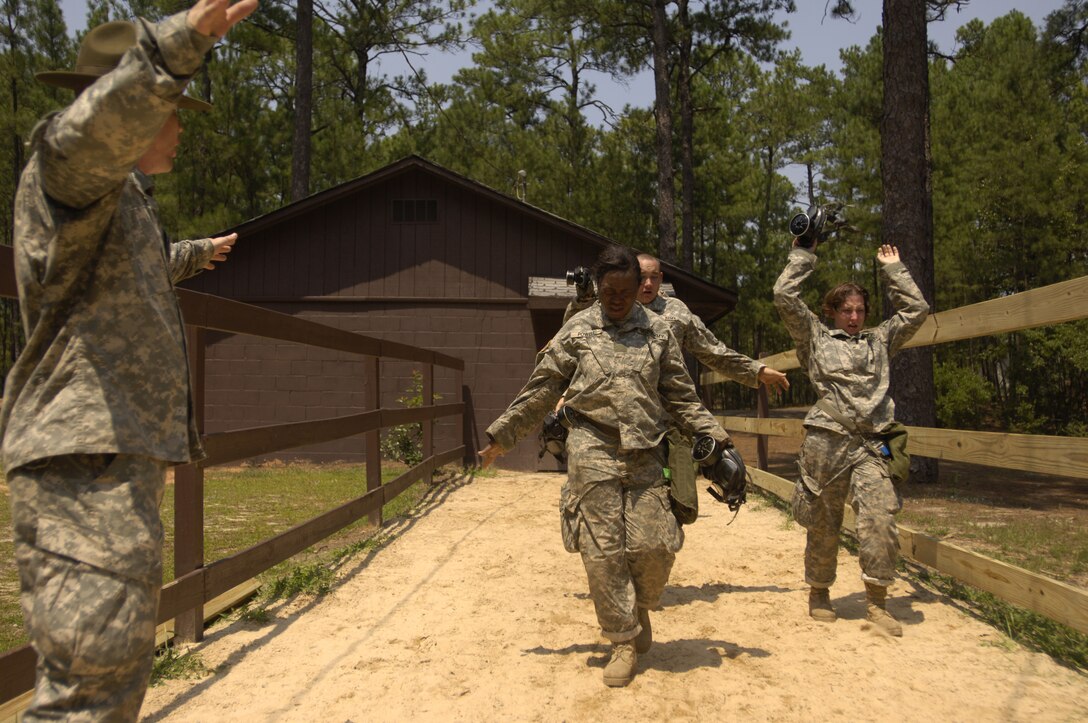 U.S. Army privates run out of the chemical chamber during Army basic training at Fort Jackson, S.C., Aug. 10, 2006. 