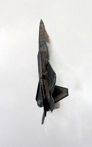 ELMENDORF AIR FORCE BASE, Alaska -- An F-22A hovers in the clouds during Arctic Thunder, Elmendorf's air show and open house, Aug. 13. The Raptor was flown by Maj. Michael "Dozer" Shower, who will become the first commander of the F-22A squadron here in the summer of 2007. (U.S. Air Force photo by Airman Jonathan Steffen)