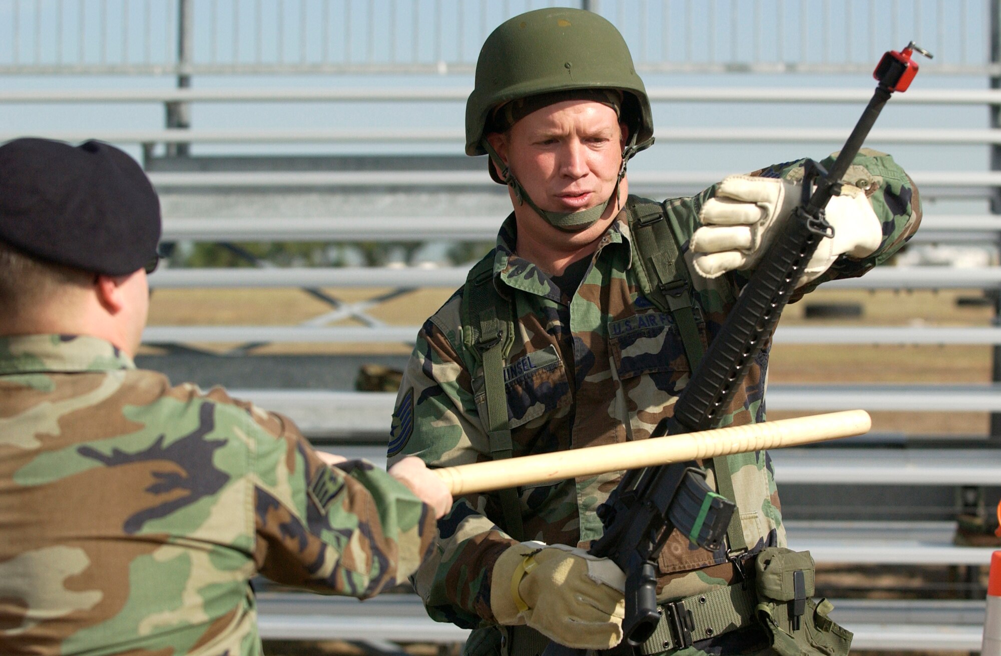 BUCKLEY AIR FORCE BASE, Colo. -- Tech Sergeant Kerry Winsel, 460 Space Communications Squadron, practices rifle fighting during the Contingency Skills Training course Buckley AFB, Colo., on July 11, 2006.  The 460 Security Forces Squadron conducted the training to prepare Airmen for future deployments. (U.S. Air Force photo by Staff Sergeant Chenzira Mallory)

