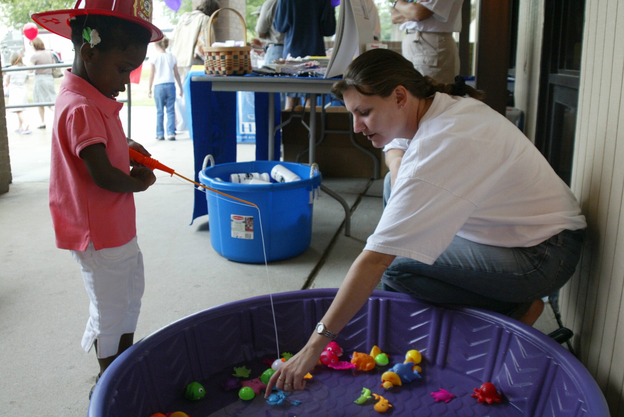 POPE AIR FORCE BASE , N.C. -- Alexis Thompson, 3, tries to catch a fish Saturday after the Back to School Health Fair. (U.S. Air Force photo/Lisa Terry McKeown)