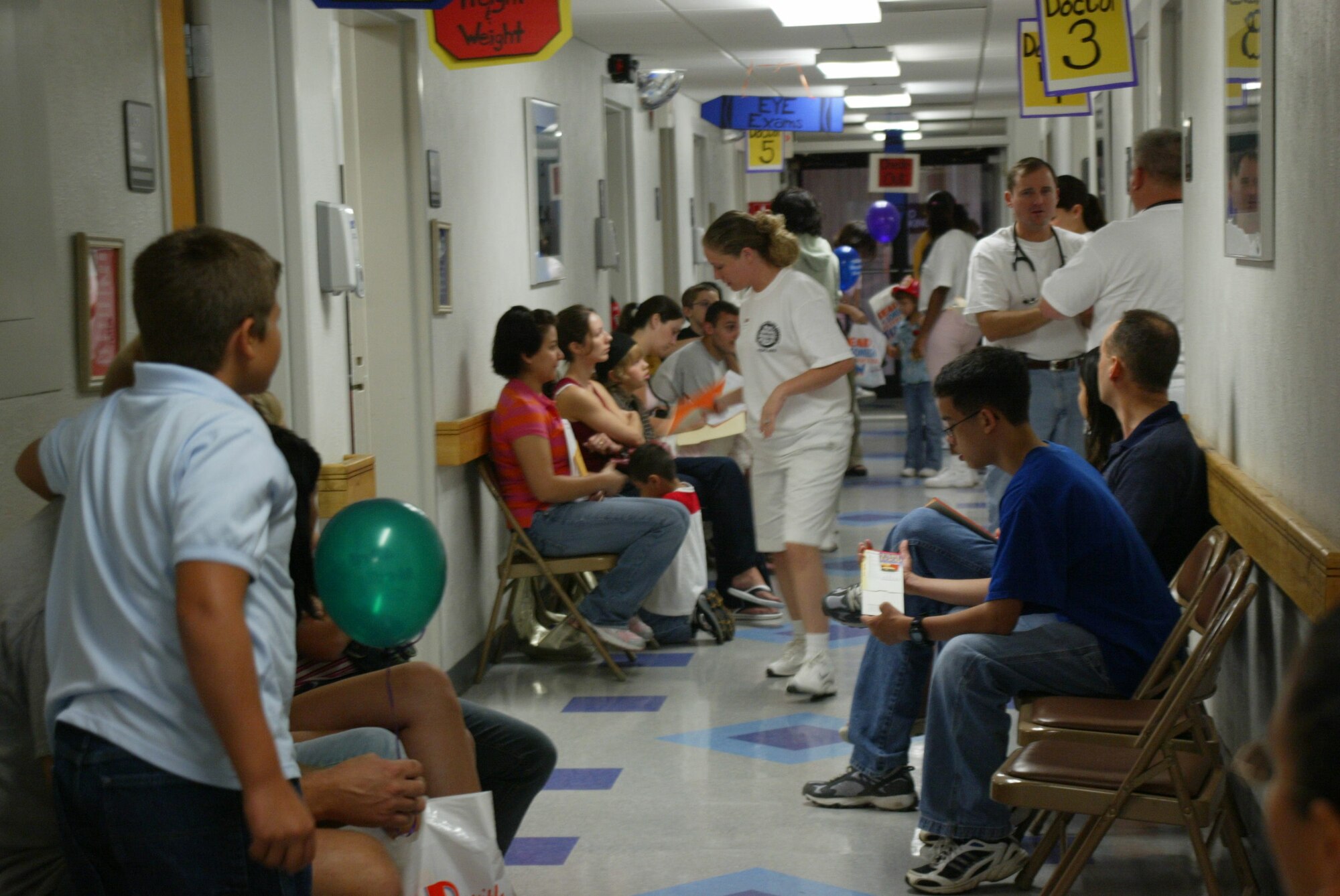 POPE AIR FORCE BASE , N.C. -- The hallways of Pope's medical clinic were full Saturday as families came in to the one-stop shop for back to school physicals and immunizations. (U.S. Air Force photo/Lisa Terry McKeown)
