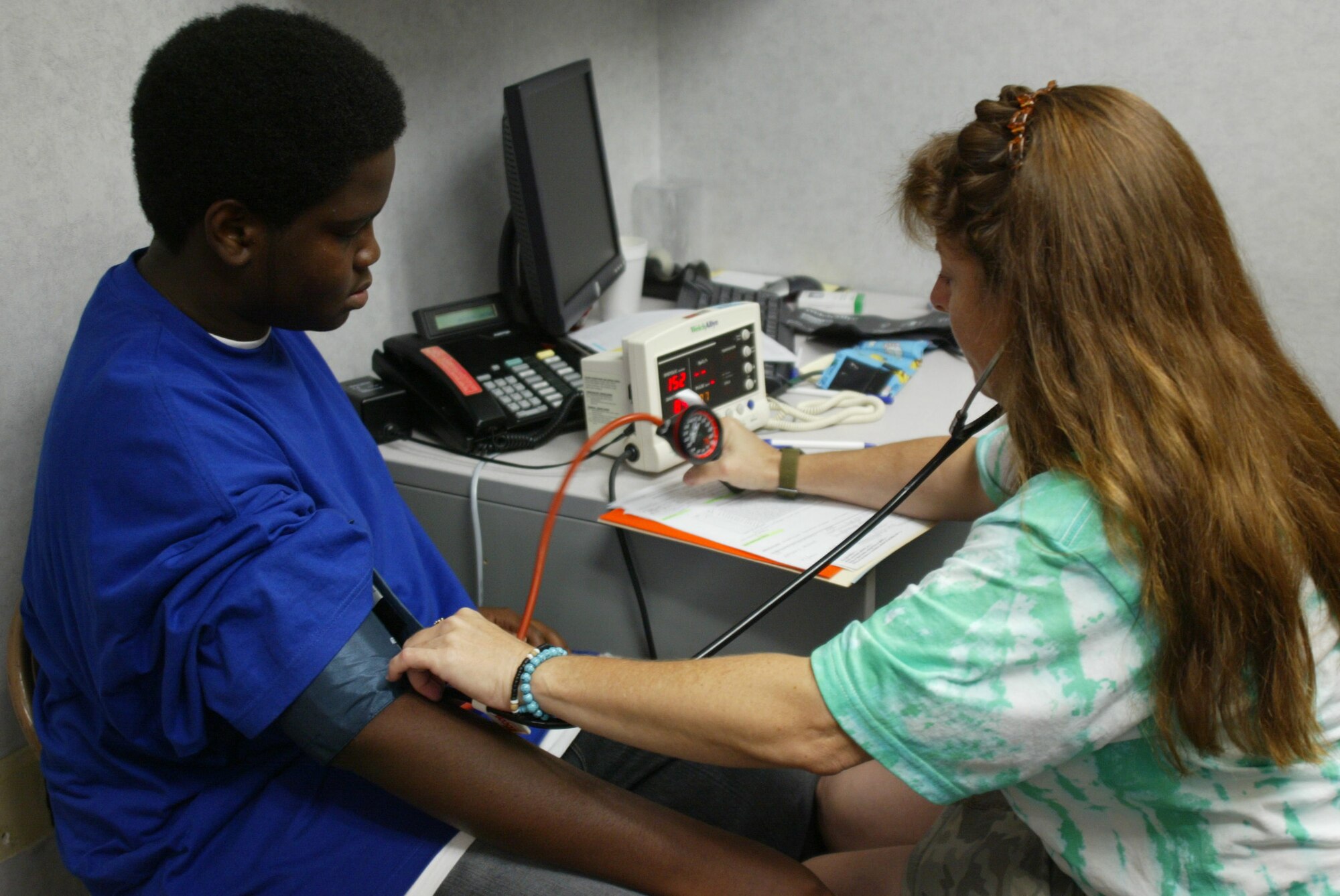 POPE AIR FORCE BASE , N.C. -- Eighth grader Michael Adderly gets his blood pressure checked before being seen by a medical provider.  (U.S. Air Force photo/Lisa Terry McKeown)