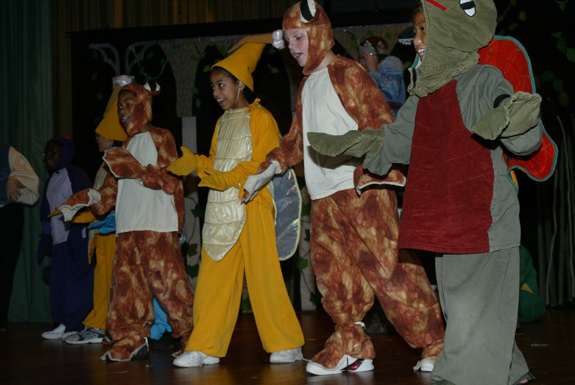 POPE AIR FORCE BASE , N.C. -- Pope and Fort Bragg youth play swamp things at a dress rehearsal for The Frog Prince. The children put on the production with the help of the Missoula Children's Theater. (U.S. Air Force photo/Lisa Terry McKeown)