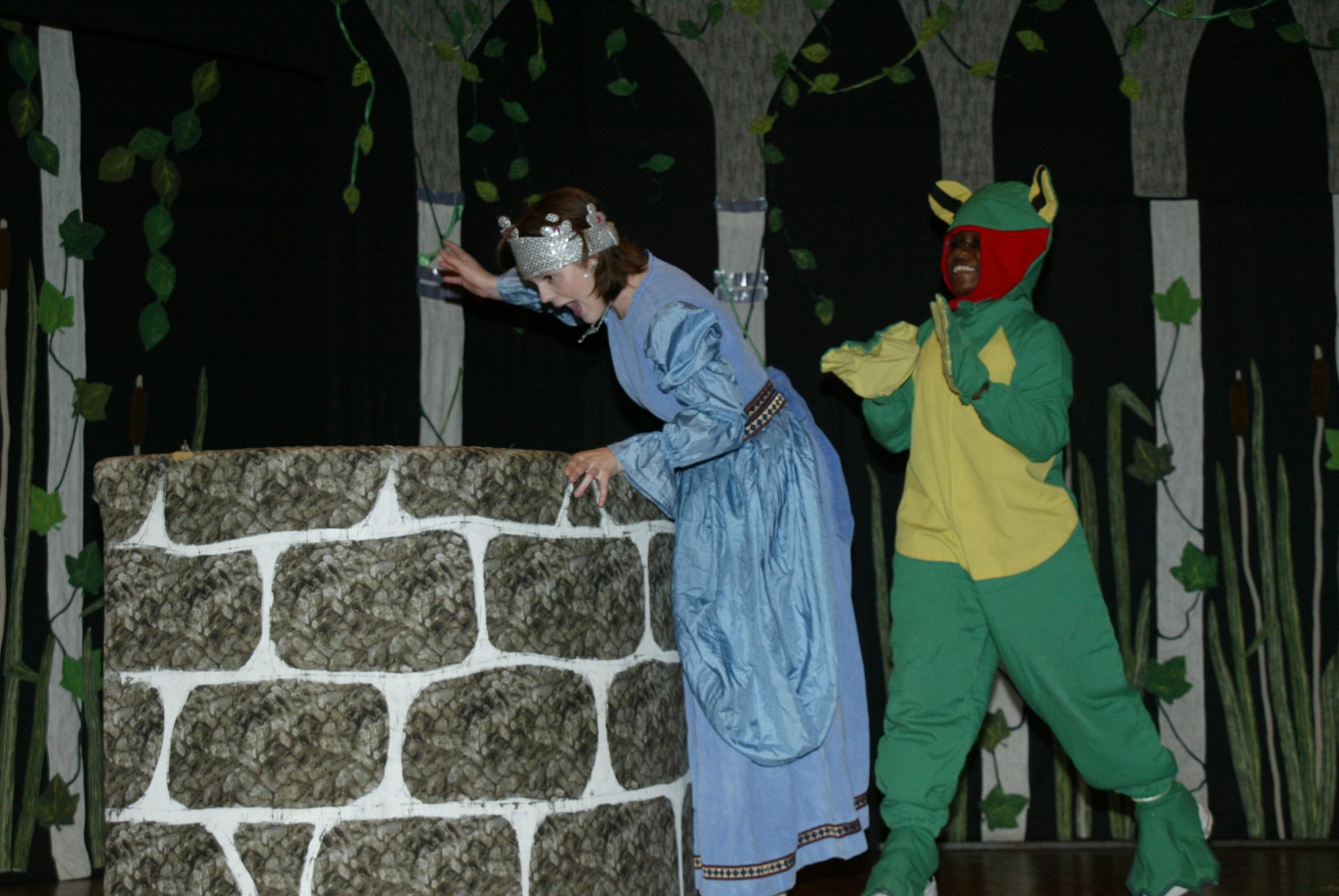 POPE AIR FORCE BASE , N.C. -- Princess Pim, played by Brittany Willis, turns away in fear of a swamp frog in the play The Frog Prince. Pope and Fort Bragg youth performed the Missoula Children's Theater production Saturday at the base theater. (U.S. Air Force photo/Lisa Terry McKeown)