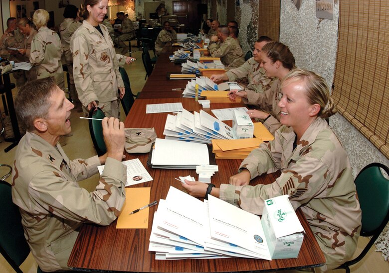 Tech. Sgt. Tamlyn Martin instructs Col. Perry Cooper on how to properly provide a swab sample during a bone marrow donor registration drive at a forward operating base in Southwest Asia. The drive was organized by a deployed Airman in memory of her son, who lost his battle with acute lymphoblastic leukemia last September. The drive drew 685 new registrants to the national donor registry. Colonel Cooper and Sergeant Martin are with the 379th Air Expeditionary Wing. (U.S. Air Force photo/Master Sgt. Douglas Lingefelt)