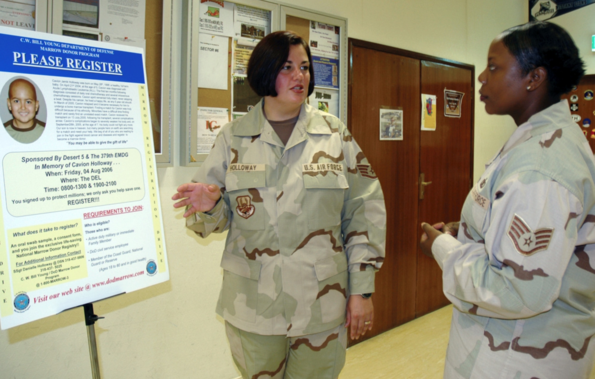 Staff Sgt. Danielle Holloway talks to Staff Sgt. Yolanda Hands about the bone marrow registration drive she organized at a forward operating base in Southwest Asia. Sergeant Holloway organized the drive in memory of her son, Cavion, who lost his battle with acute lymphoblastic leukemia last September. The drive drew 685 new registrants to the national donor registry. Sergeants Holloway and Hands are with the 379th Air Expeditionary Wing. (U.S. Air Force photo/Staff Sgt. Celena Wilson)