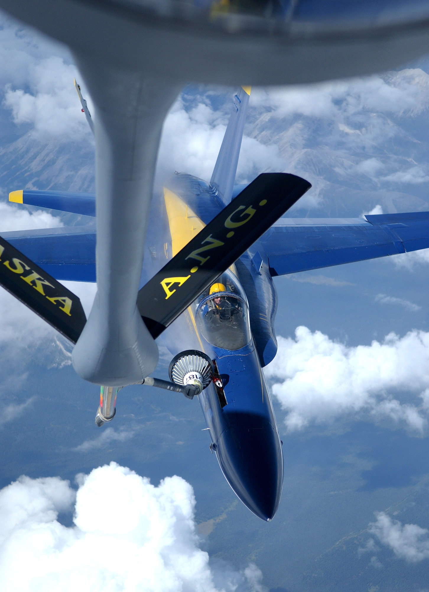 A KC-135 Stratotanker refuels an F/A-18 Hornet from the Navy's Blue Angels on its way from an air show at Elmendorf Air Force Base, Alaska, on Aug. 14. The KC-135 is with the 168th Air Refueling Wing at Eielson AFB, Alaska. (U.S. Air Force photo/Senior Airman Anthony Nelson Jr.)
