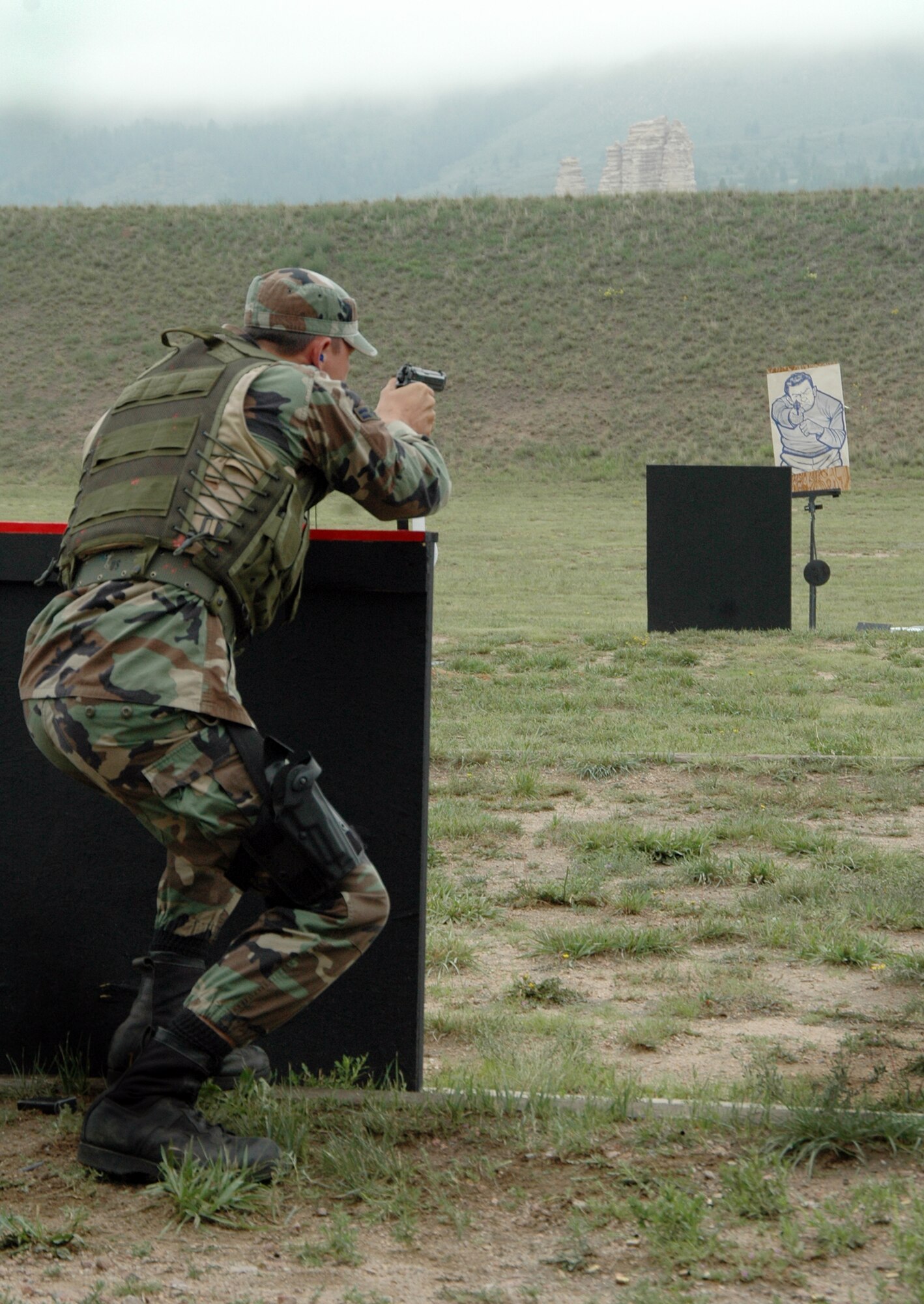 Airman 1st Class Devin Stapelman shoots a moving "enemy" target during the Air Force Space Command Guardian Challenge marksmanship competition in Colorado on Aug. 15. Airman Stapelman is with the 50th Security Forces Squadron at Schriever Air Force Base, Colo. (U.S. Air Force photo/1st Lt. Angela Webb)