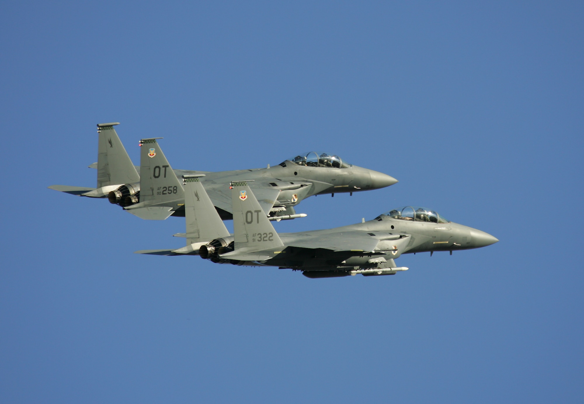 Two F-15E Strike Eagles take off from Nellis AFB, Nev., Aug. 15. The "OT" tails belong to the 53rd Wing's 422nd Test and Evaluation Squadron, which is based at Nellis. The 422nd conducts operational testing on new hardware and upgrades to the A-10, F-15, F-15E, F-16, F-22A and HH-60G. The squadron also develops and publishes new tactics for these six aircraft. (Photo courtesy Paul Ridgway, Typhire Photography) 