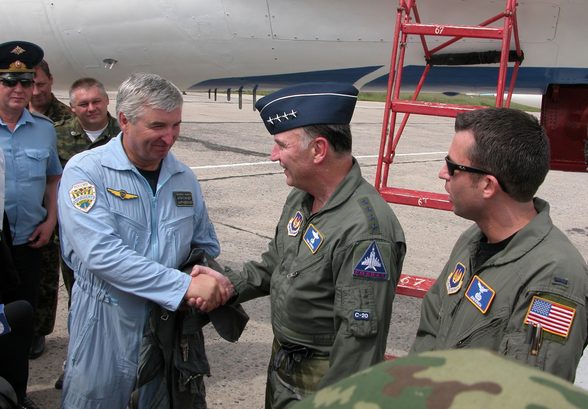 Gen. Tom Hobbins (second from right), U.S. Air Forces in Europe commander, meets Gen. Maj. Aleksandr Kharchevskiy, chief of the 4th Center for Combat Use and Flight Training, on Aug. 15. General Hobbins, who is in Russia Aug. 14 to 17 to bolster relationships and security cooperation between U.S. and Russian air forces, flew in both the SU-27 Flanker and MiG-29 Fulcrum during his visit to Lipetsk Air Base. (U.S. Air Force photo/Capt. Russell Montante) 
