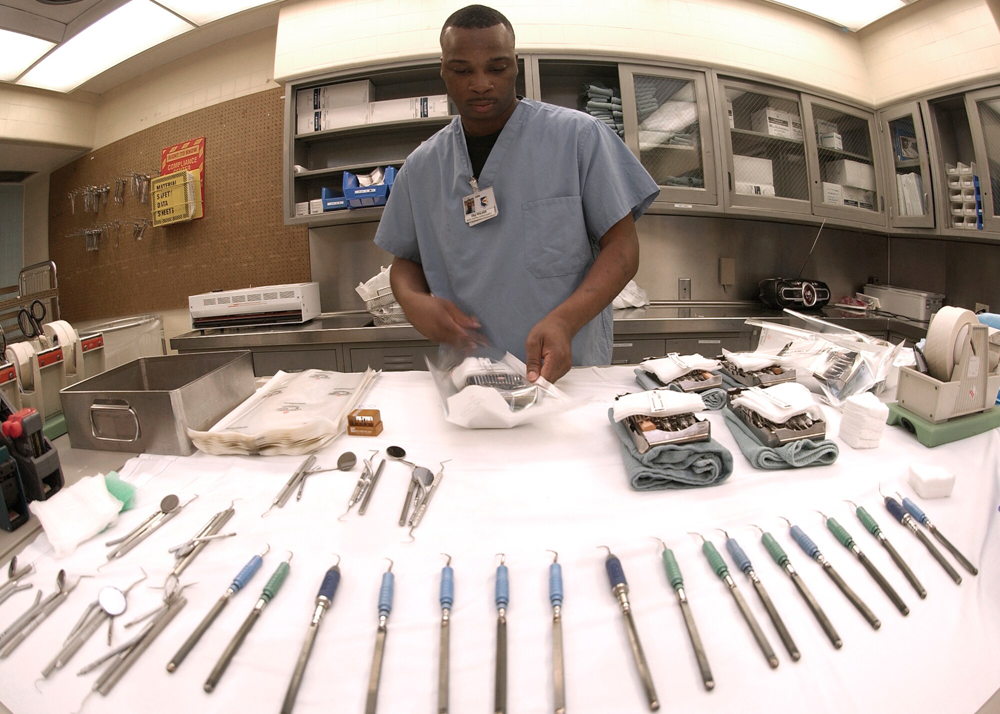 Staff Sgt. Bobby Walker sorts dental instruments and prepares them for sterilization at Davis-Monthan Air Force Base, Ariz., on Aug. 10. The 355th Dental Squadron provides services for more than 7,000 active-duty Airmen at Davis-Monthan so that they may remain mission ready. (U.S. Air Force photo/Airman Gary Walker) 
