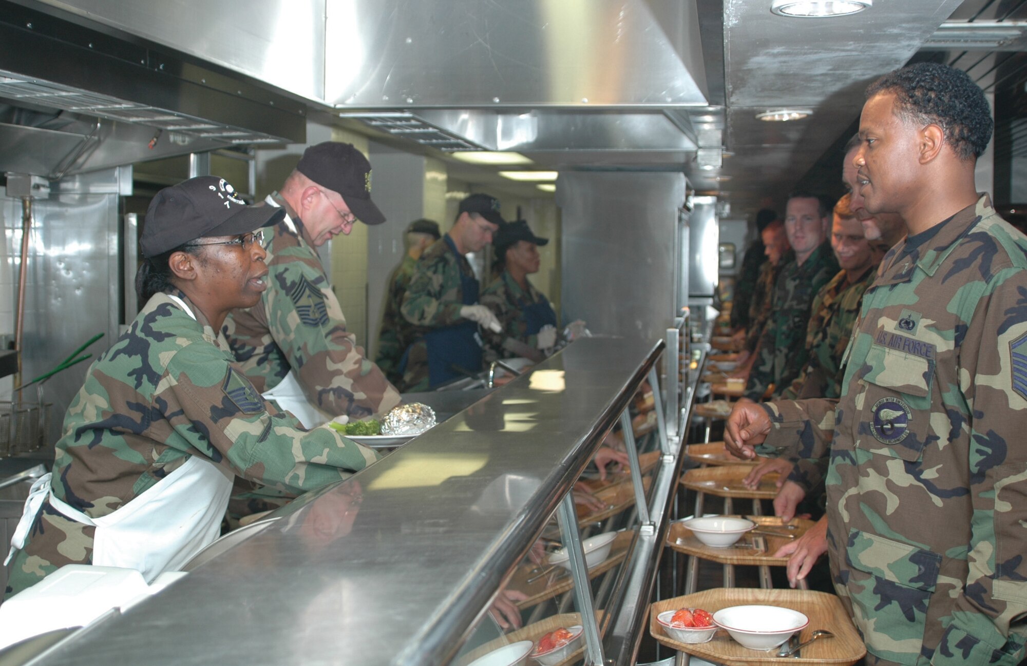 Master Sgt. Margaret Maffett, 917th Logistics Readiness Squadron first sergeant, helps serve lunch to troops Saturday, Aug. 5, in recognition of Services Appreciation Day at the Red River Dining Facility (U.S. Air Force photo/Tech. Sgt. Jeff Walston).