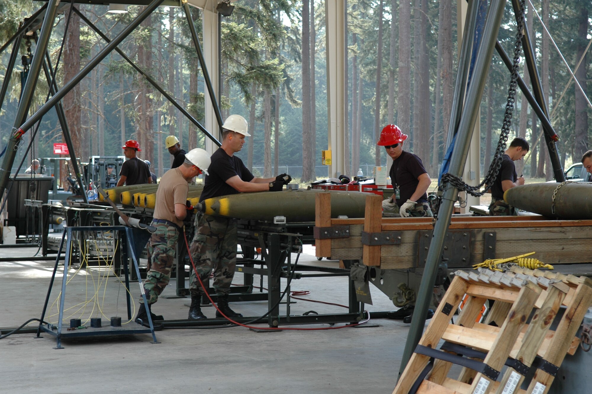 Member of the 917th Munitions Flight and 62d Munitions Flight, McChord AFB, Wash., build MK-82s in support of Operation Patriot Knife, Aug. 8. The 47th Fighter Squadron deployed to McChord AFB, Wash., where they dropped live munitions on the Yakima Range for training of the A-10 personnel. (U.S. Air Force photo/Senior Master Sgt. Jessica D'Aurizio)          
