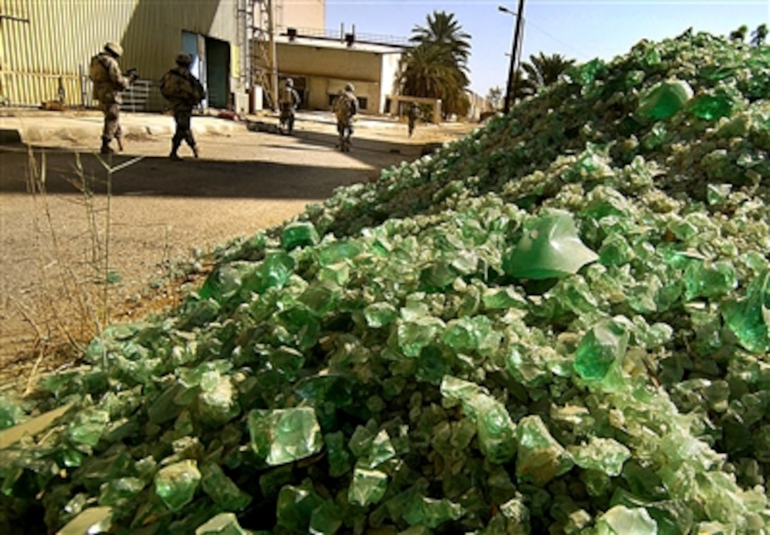 U.S. Army soldiers from the 6th Infantry Regiment, attached to the 1st Armored Division, conduct a cordon search of a glass factory during a patrol in Tameem, Ramadi, Iraq, Aug. 10, 2006.