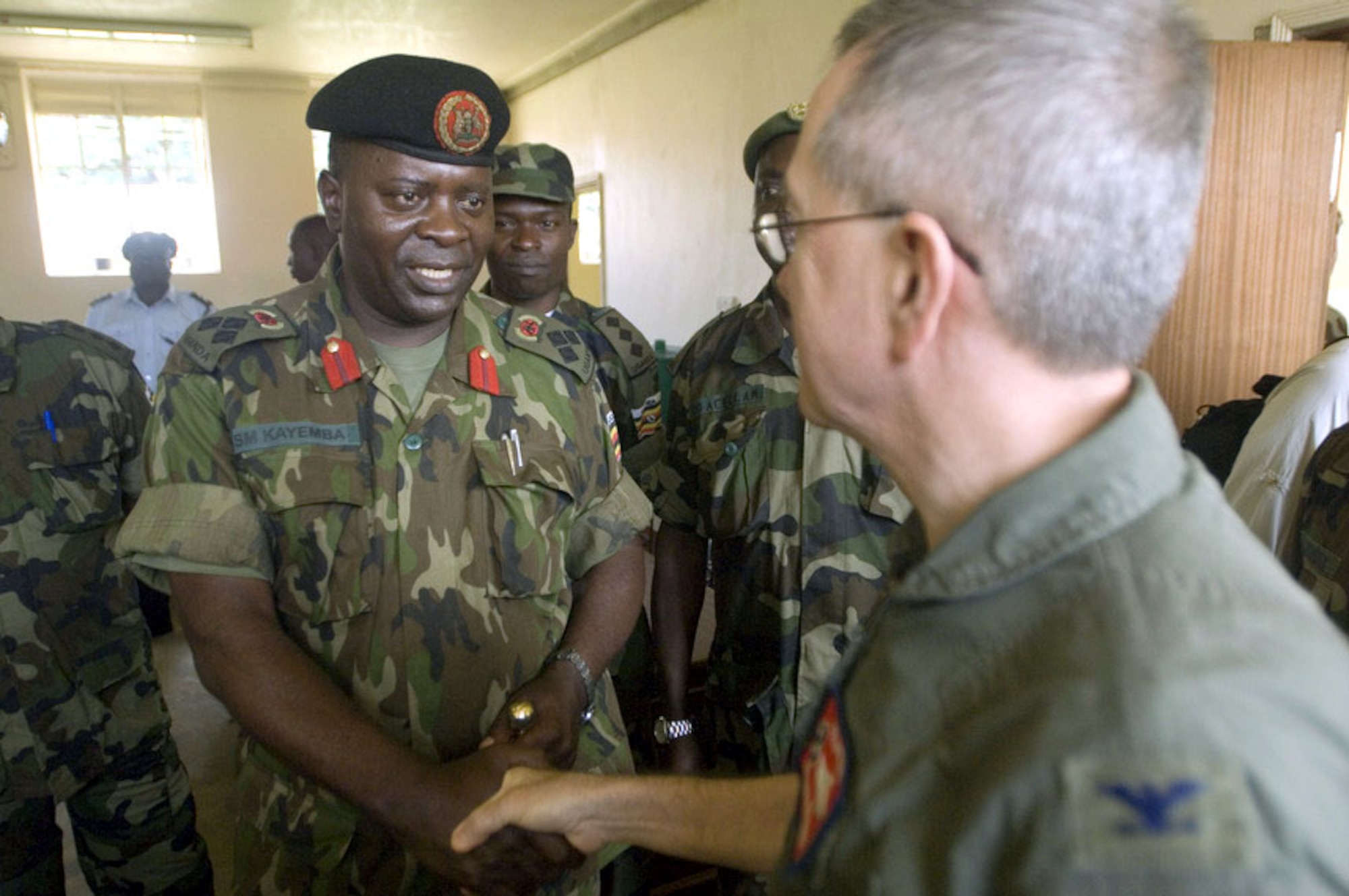 Ugandan Brig. Gen. Silver Kayemba welcomes Col. (Dr.) William Walters to Soroti, Uganda, for the training exercise Natural Fire 2006 on Aug. 9. General Kayemba is chief of operations and training for the Ugandan police and defense force. Colonel Walters is with the Tennessee Air National Guard. (U.S. Air Force photo/Master Sgt. John E. Lasky)