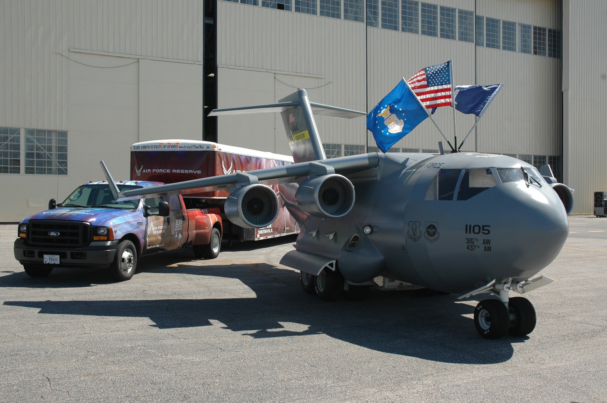 Charleston AFB's miniature C-17 replica, the Spirit of Hope, Liberty and Freedom, in front of its trailer with new graphics provided by the AFRC's Recruiting Service.  The miniature C-17 will travel around the country and be used as a community outreach and recruiting tool.  (Photo by Capt. Wayne Capps)