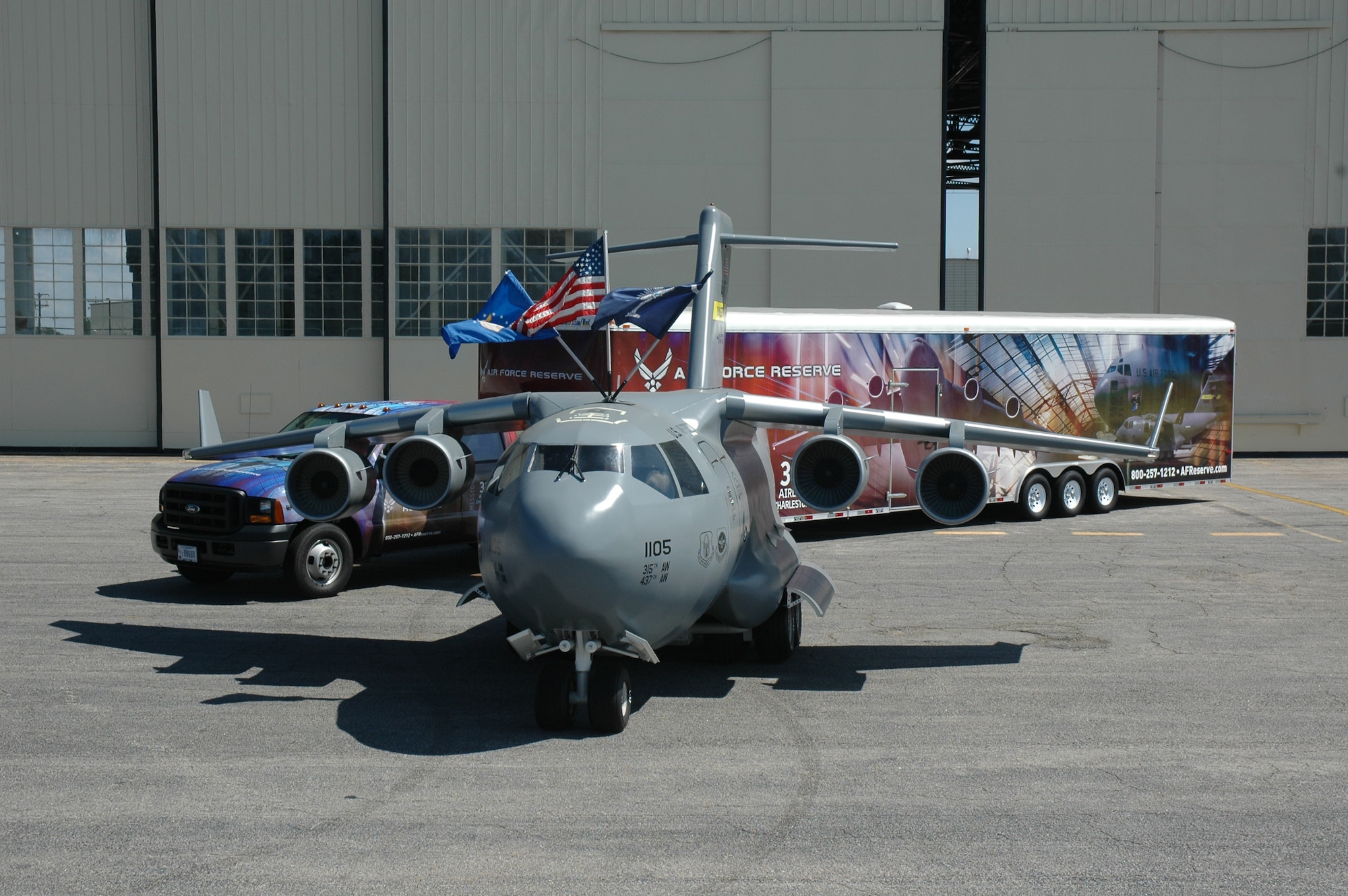 Charleston AFB's miniature C-17 replica, the Spirit of Hope, Liberty and Freedom, in front of its trailer with new graphics provided by the AFRC's Recruiting Service.  The miniature C-17 will travel around the country and be used as a community outreach and recruiting tool.  (Photo by Capt. Wayne Capps)