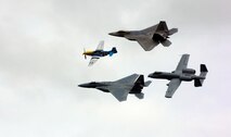 A heritage flight with a P-51 Mustang, F-15 Eagle, F-22 Raptor and A-10 Thunderbolt II fly over the crowd at the Arctic Thunder air show at Elmendorf Air Force Base, Alaska, on Aug. 12. The two-day event drew nearly 136,000 visitors. (U.S. Air Force photo/Airman Jonathan Steffen) 