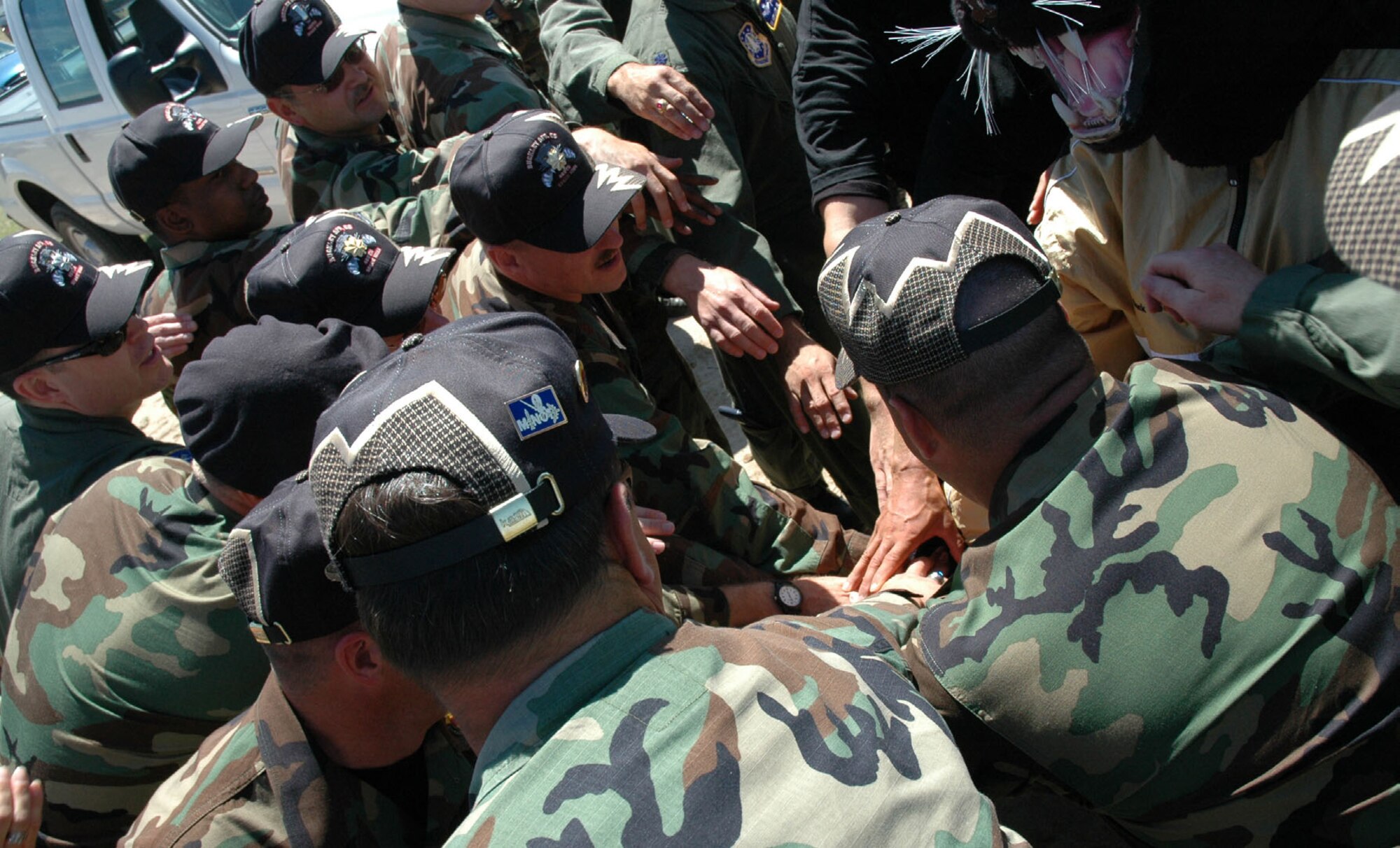 460th Space Wing Guardian Challenge members from Buckley Air Force Base, Colo., cheer their defender team after the obstacle course competition Aug. 16. (U.S. Air Force photo by Tech. Sgt. Kate Rust)