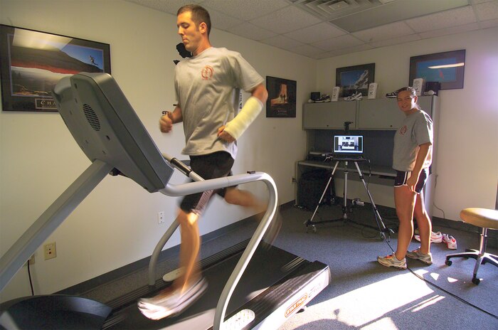Staff Sgt. Chad Butler, 437th Aircraft Maintenance Squadron electro-environmental craftsman, has his gait analyzed by Laura Markuly, 437th Medical Group exercise physiologist, on the Health and Wellness Center's new gait analysis system Tuesday. (U.S. Air Force photo by Airman 1st Class Sam Hymas) 