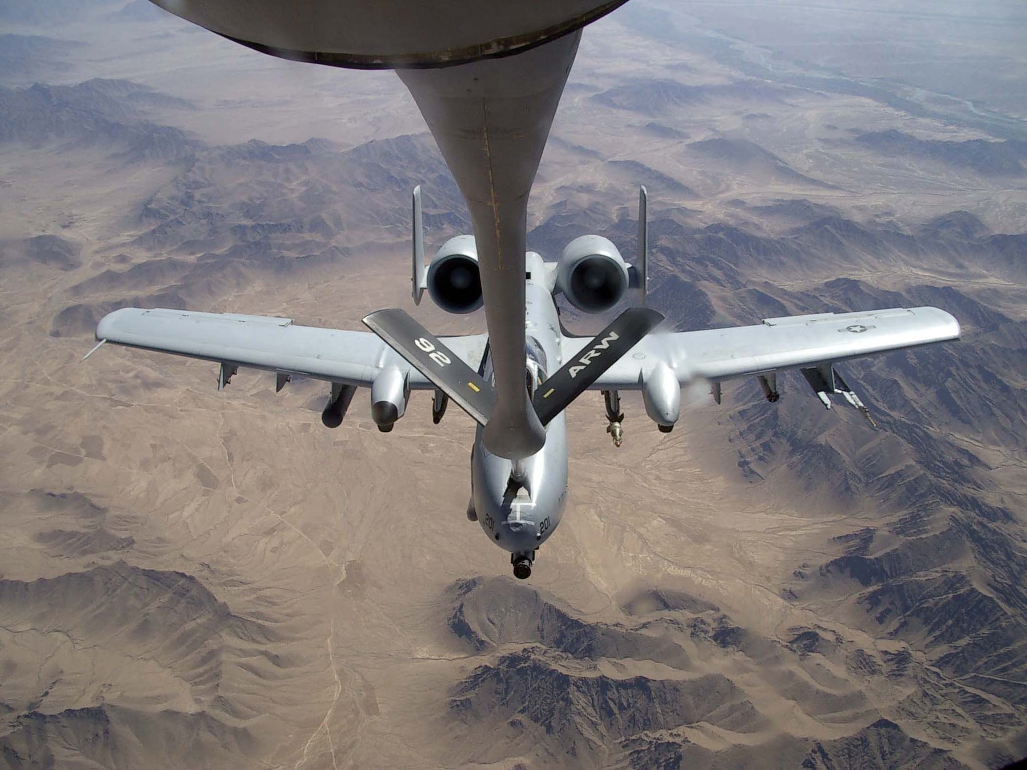 An A-10 Thunderbolt II from the 81st Expeditionary Fighter Squadron at Bagram Airfield, Afghanistan, takes on gas from a KC-135 Stratotanker from the 22nd Expeditionary Air Refueling Squadron over Afghanistan. The 22nd EARS is part of the 376th Air Expeditionary Wing, Manas Air Base, Kyrgyzstan.  This A-10 is deployed from the Air Force Reserve?s 442nd Fighter Wing at Whiteman Air Force Base, Mo. (US Air Force photo/Airman 1st Class Lonnie Mast)