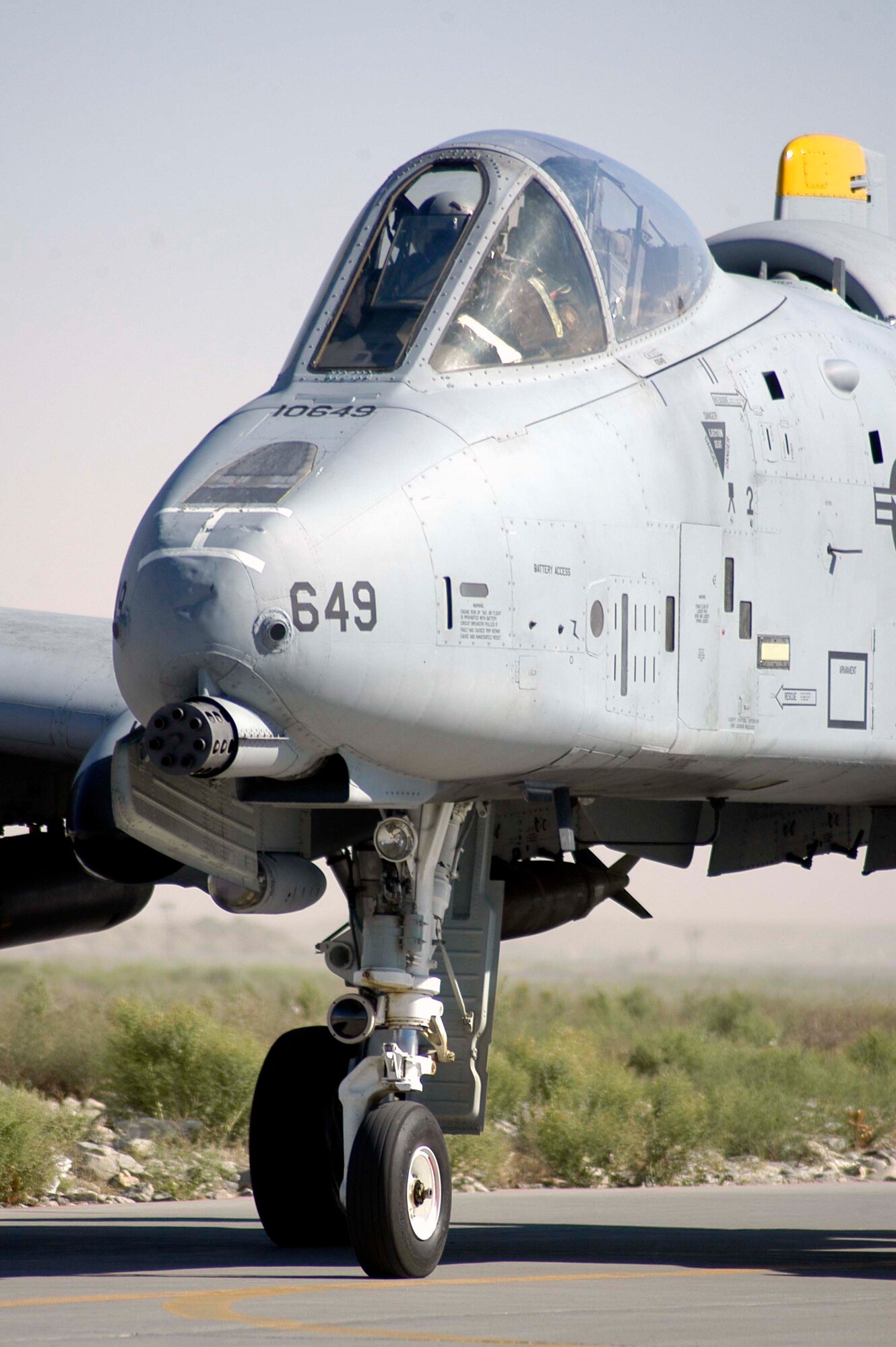 An A-10 Thunderbolt II from the 81st Expeditionary Fighter Squadron, taxis to a de-arm area at Bagram Airfield, Afghanistan, following a combat sortie over Afghanistan June 13, 2006. The A-10's 30-mm gun, a signature capability of the aircraft, delivers enormous firepower to support ground forces engaged against anti-Coalition extremists. This A-10 is deployed to Bagram from the 81st Fighter Squadron at Spangdahlem Air Base, Germany. In addition to the 81st FS, the Air Force Reserve's 442nd Fighter Wing, from Whiteman Air Force Base, Mo., contributed aircraft, pilots and maintainers to the 455th Air Expeditionary Wing at Bagram for this summer's Air Expeditionary Force rotation. (US Air Force photo/Maj. David Kurle)