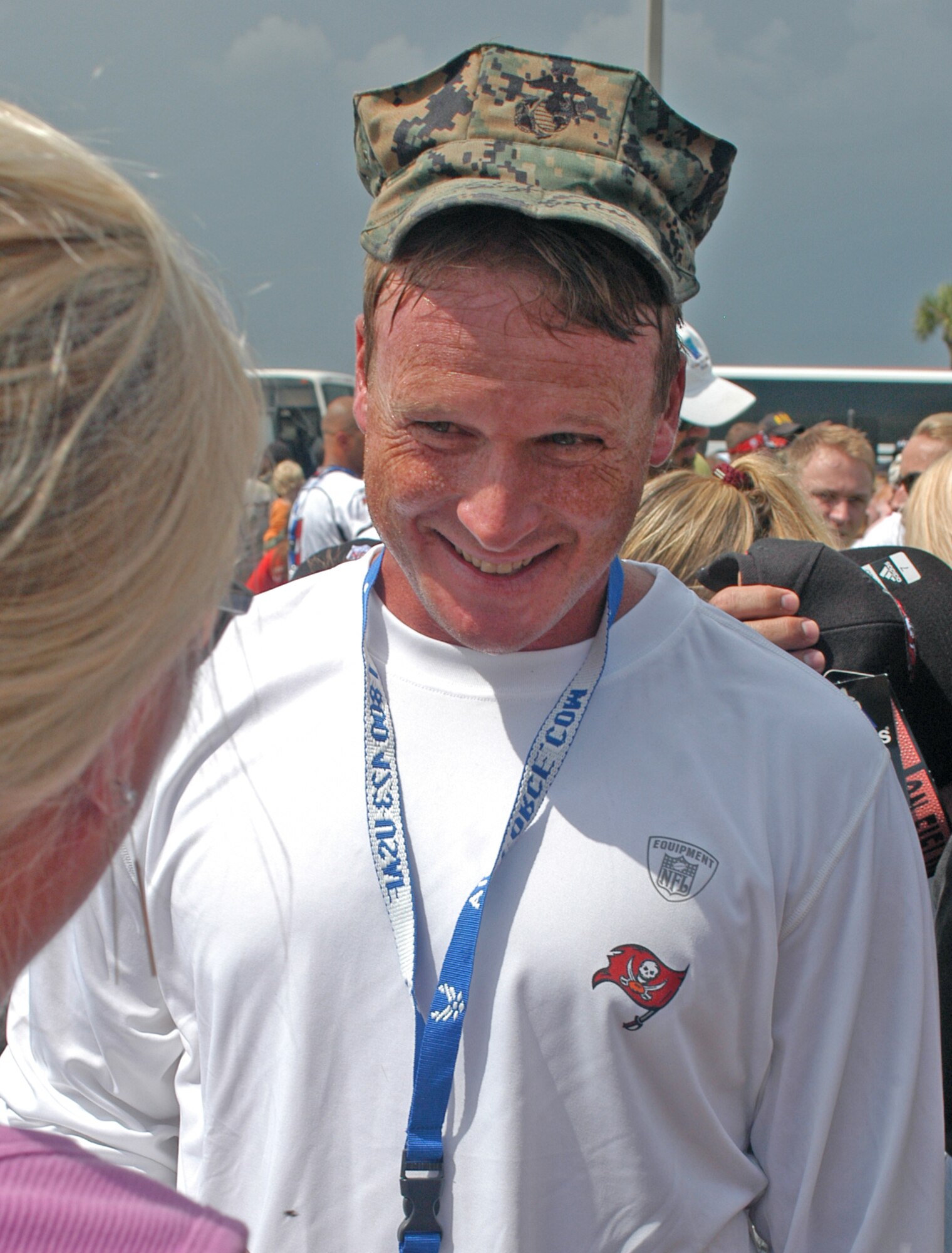 Jon Gruden, Tampa Bay Buccaneers head coach, signs an autograph for a fan after the pre-game, walkthrough practice held at MacDill AFB, Fla., Friday, Aug. 8. Friday’s practice was open to base personnel but closed to the general public.