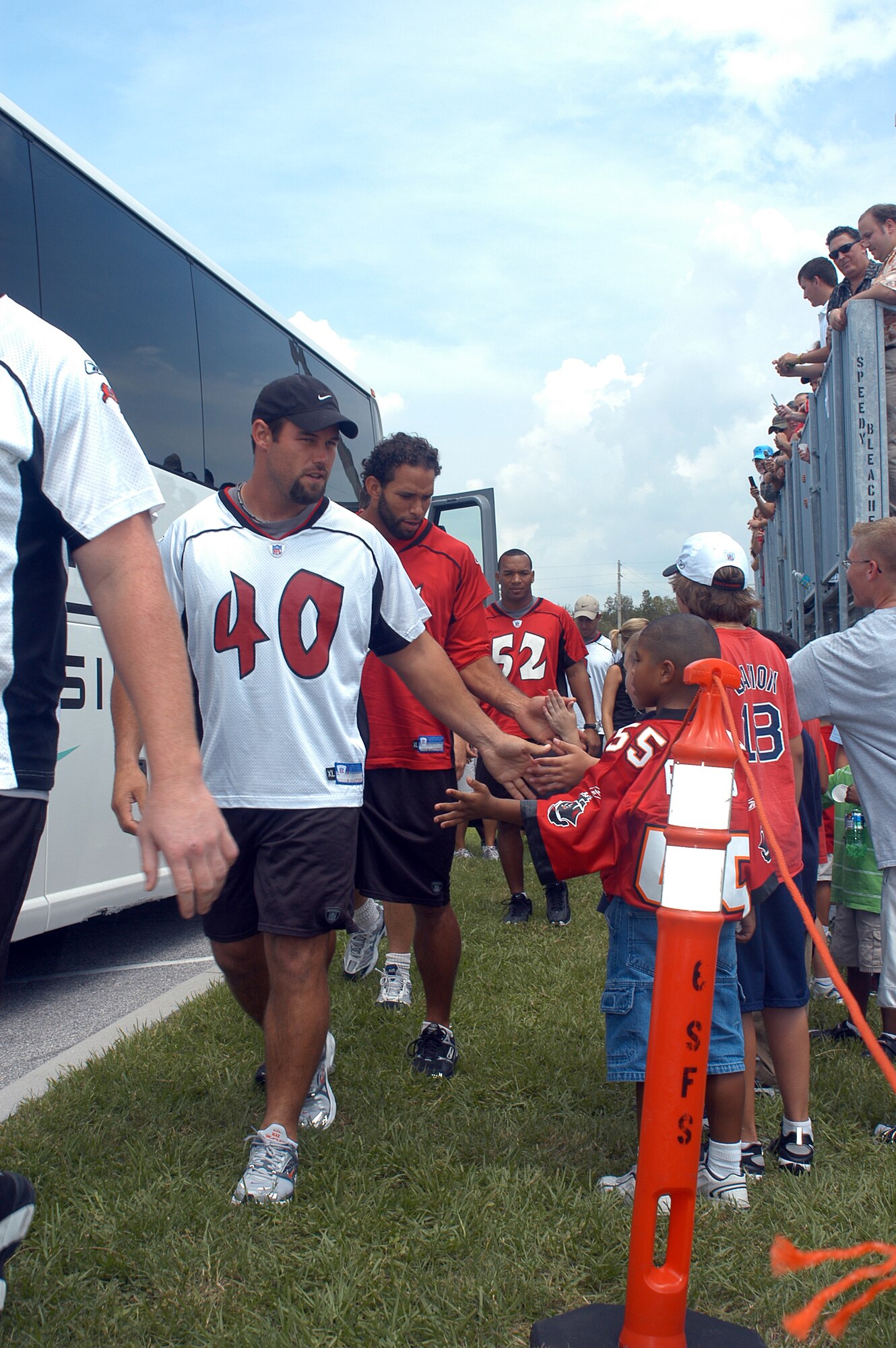 Mike Alstott, Tampa Bay Buccaneers starting fullback, greets fans before the pre-game, walkthrough practice held at MacDill AFB, Fla., Friday, Aug. 8. Active-duty military who attended were able to stand on the base’s multi-purpose athletic field and get an up-close look at the 2006 Buccaneers