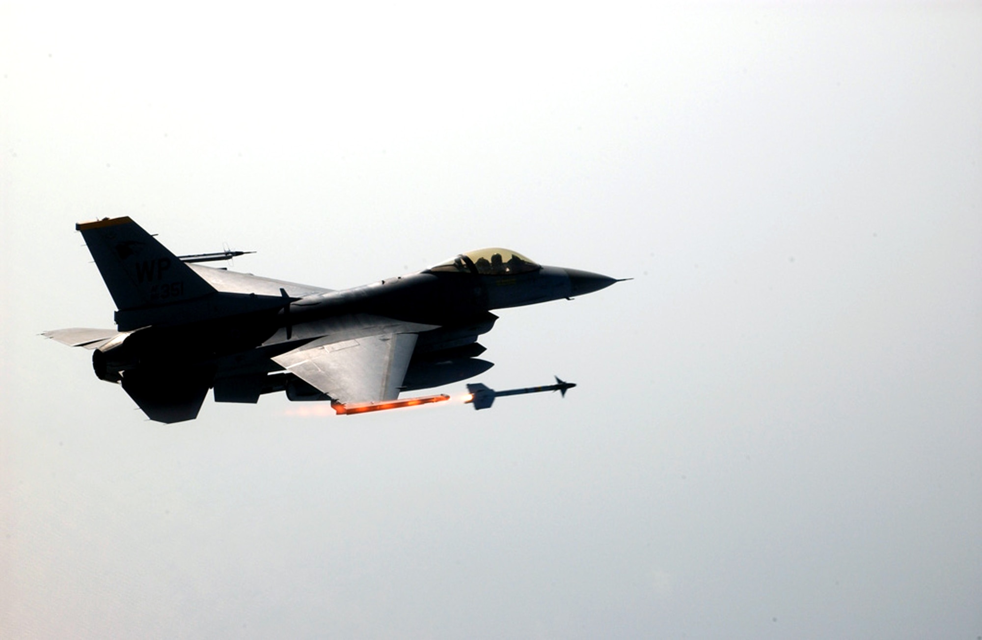 An F-16 Fighting Falcon pilot fires one of the first air-to-air missiles launched by a South Korean-based F-16 on Aug. 16. The live fire is part of a process for implementing a weapon system evaluation program for jets assigned to Kunsan Air Base, Korea. (U.S. Air Force photo/Tech. Sgt. Jeffrey Allen)