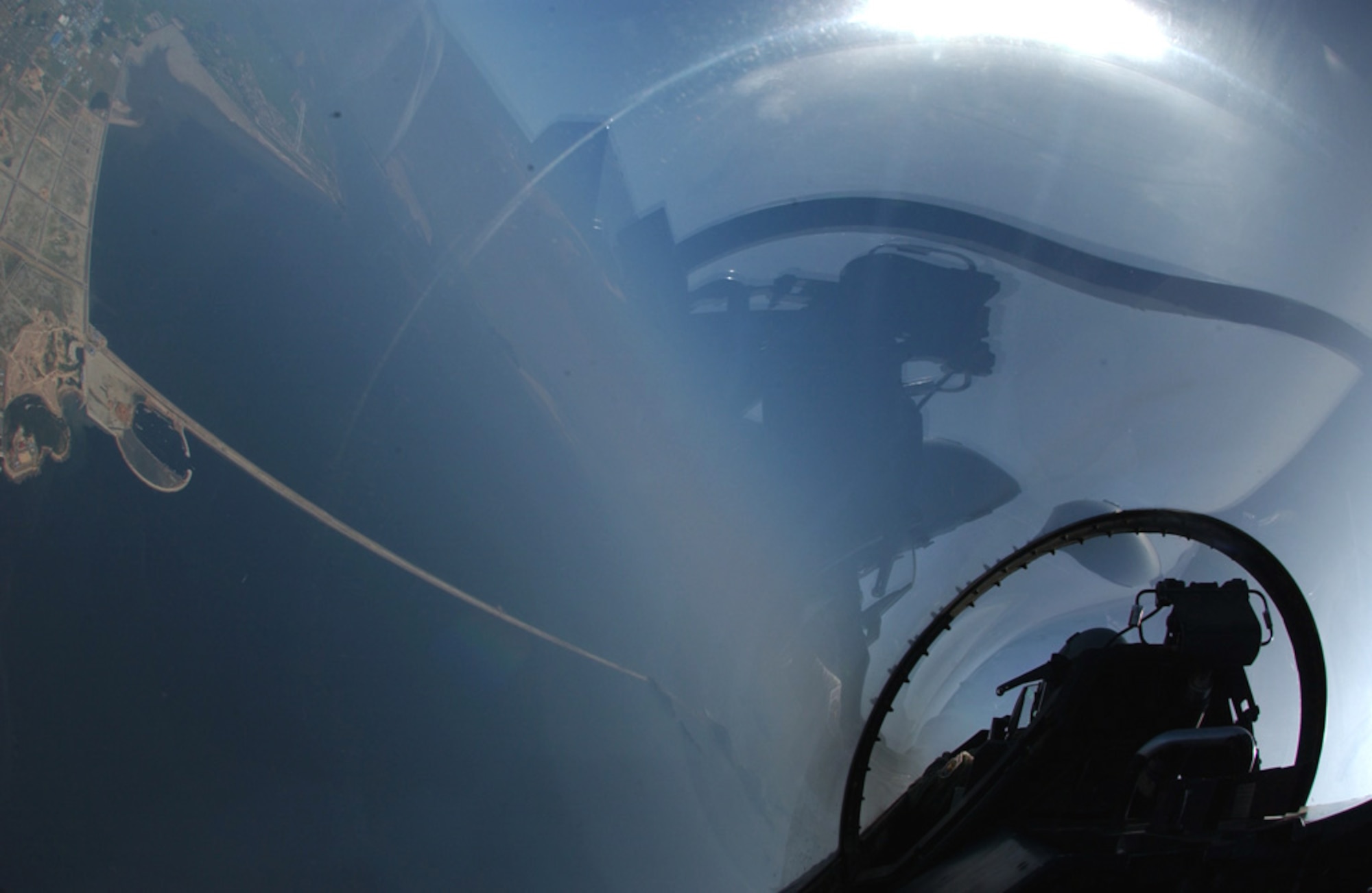 An F-16 Fighting Falcon from Kunsan Air Base, South Korea, flies toward a military operating area on Aug. 16. Pilots from Kunsan employed AIM-9 Sidewinder missiles on Aug. 16 for the first time in the history of 7th Air Force in Korea. (U.S. Air Force photo/Tech. Sgt. Jeffrey Allen) 