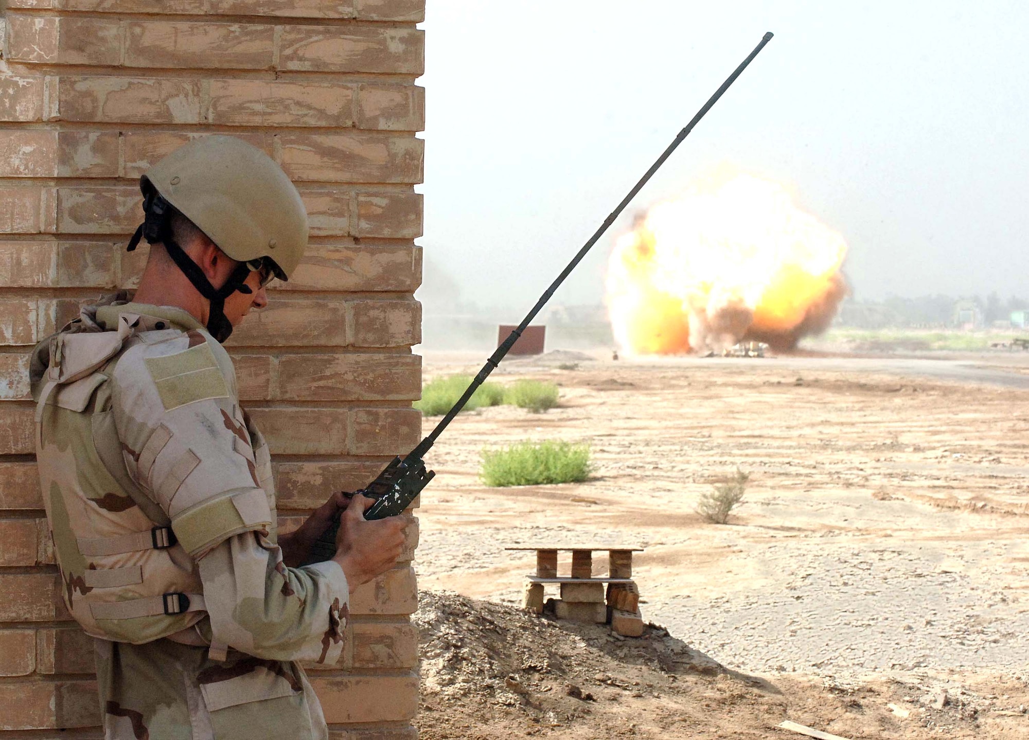 Staff Sgt. Andrew Smith commands a detonation of explosives on a range adjacent to Baghdad International Airport, Iraq, on Aug. 18. The Air Force explosive ordnance disposal unit at the airport is responsible for a 500-square mile area around Baghdad as part of a joint task force. Sergeant Smith is an EOD technician deployed to the 447th Air Expeditionary Group from Ramstein Air Base, Germany. (U.S. Air Force photo/Staff Sgt. Bryan Bouchard) 

