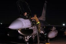 Capt. Jeremy Ryan and Tech. Sgt. Mike Johanns conduct final preflight inspections on an F-16 Fighting Falcon at Red Flag 06-02 at Nellis Air Force Base, Nev., on Aug. 15.   U.S. and coalition servicemembers are participating in the exercise that concludes today. Captain Ryan is a pilot and Sergeant Johanns is a crew chief with the Iowa Air National Guard's 132nd Fighter Wing. (U.S. Air Force photo/Tech. Sgt. Bob Sommer) 