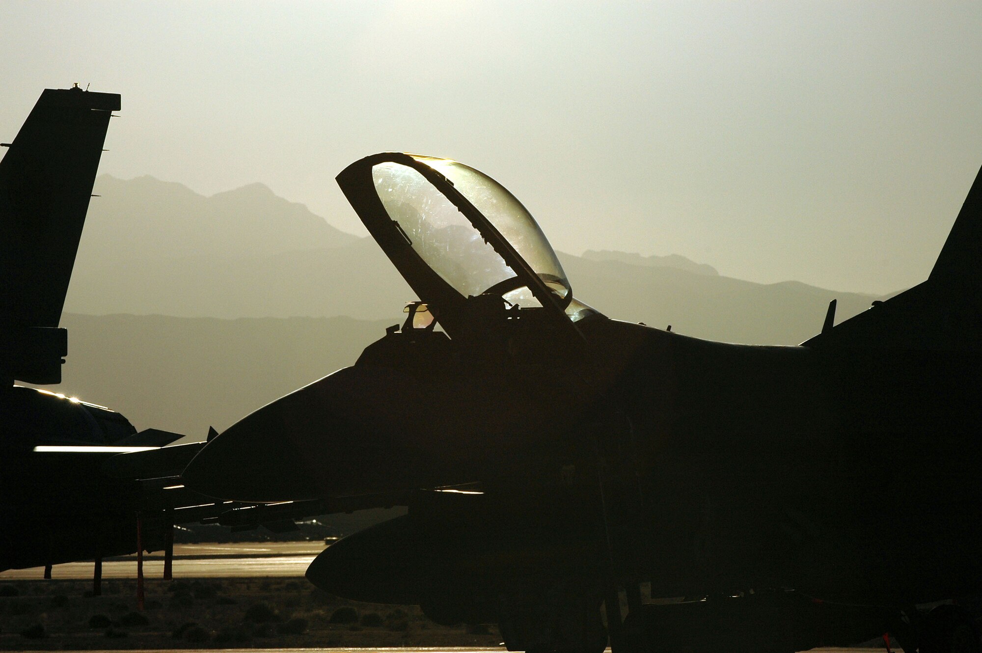 An F-16 Fighting Falcon from the Iowa Air National Guard's 132nd Fighter Wing sits ready during Red Flag 06-02 at Nellis Air Force Base, Nev., on Aug. 15. U.S. and coalition servicemembers are participating in the exercise that concludes today. (U.S. Air Force photo/Tech. Sgt. Bob Sommer) 
