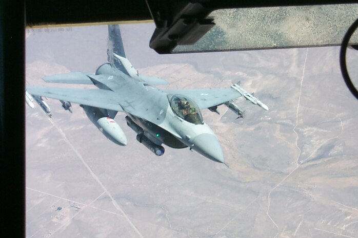 An Iowa Air National Guard F-16 pulls away from a KC-135 tanker during a Red Flag exercise Aug. 17. Red Flag brings together up to 110 aircraft and more than 2,500 Airmen from around the world, including Allied air forces, to sharpen large-force combat skills. The current Red Flag exercise at Nellis AFB ends Sept. 2. (U.S. Air Force photo/Mike Estrada)
