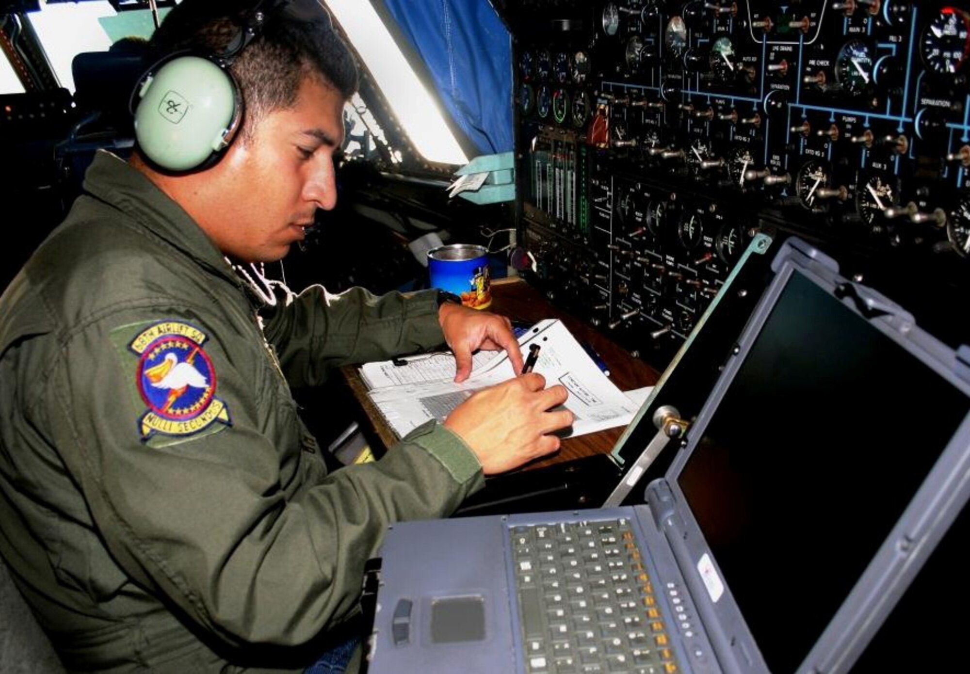 Flight engineer, Staff Sgt. David Ortegon, 68th Airlift Squadron, checks the C-5's fuel load during the flight from March Air Reserve Base, Calif. to Hickam AFB, Hawaii, Sunday, Aug. 13. (US Air Force photo by Master Sgt. Ray Sarracino)