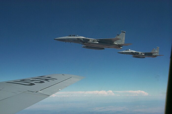F-15 Eagles from the 18th Wing, Kadena Air Base, Japan, wait their turn on the boom of a KC-135 tanker flown by a crew from the 6th Air Mobility Wing, MacDill AFB, Fla., Aug. 17. The Eagle's mission during Red Flag is to destroy enemy aircraft and allow the rest of the friendly Blue forces to attack their targets. Red Flag continues at Nellis AFB, Nev., through Sept. 2. (U.S. Air Force photo/Mike Estrada)