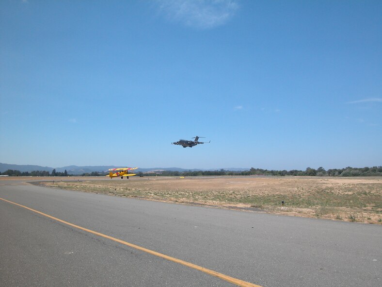 A C-17 Globemaster III assigned to the 729th Airlift Squadron at March ARB preapares to land at Sonoma County Airport in Santa Rosa, California, in preparation for the county's annual Wings Over Wine Country airshow held August 19 and 20. (U.S. Air Force Photo by Staff Sgt. Joe Davidson) 