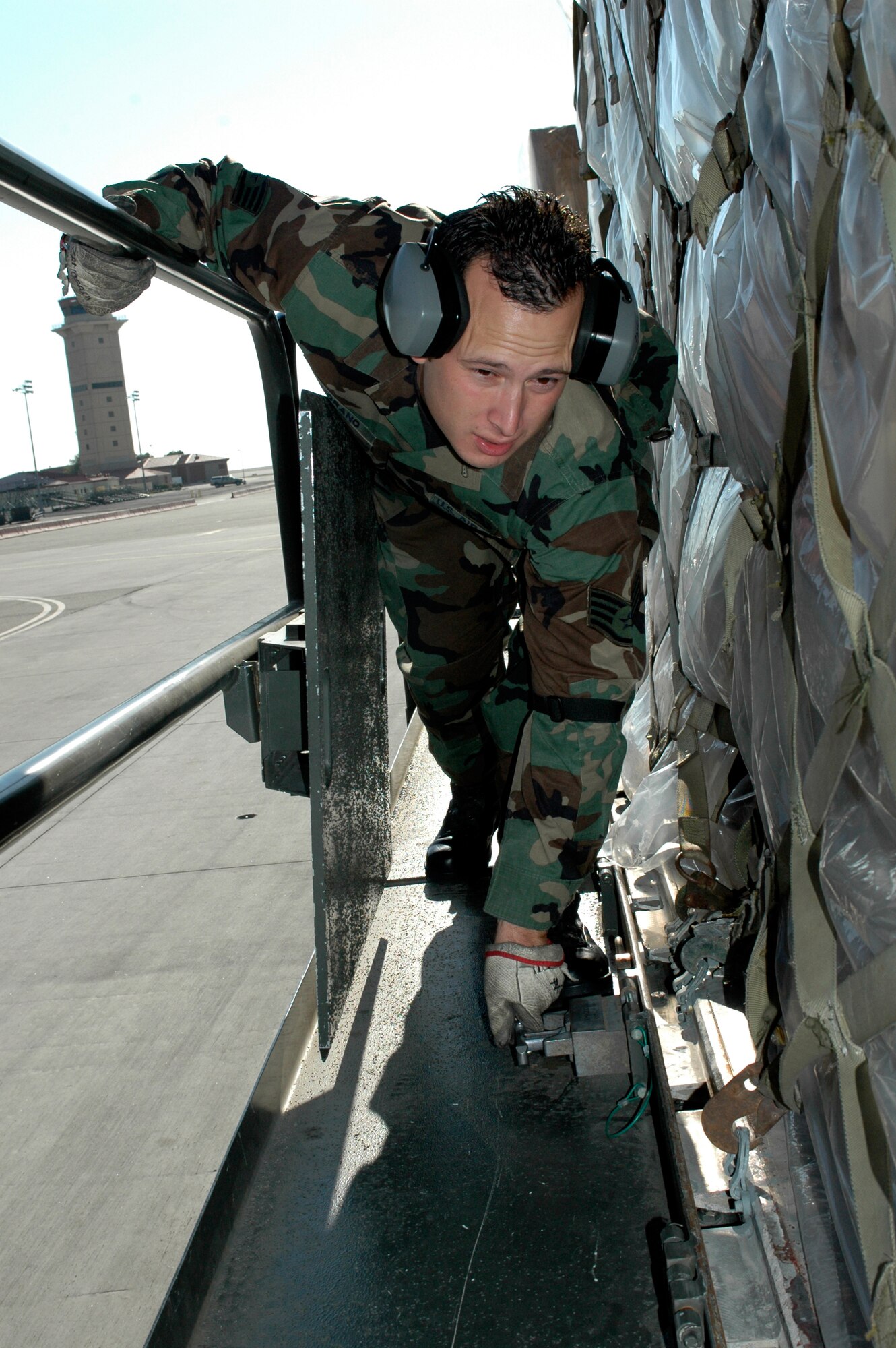 Staff Sgt. Francisco Zamorano, 60th Aerial Port Squadron, prepares cargo for Travis Air Force Base's first C-17 mission. (U.S. Air Force photo/Tech. Sgt. Donald Osborn)