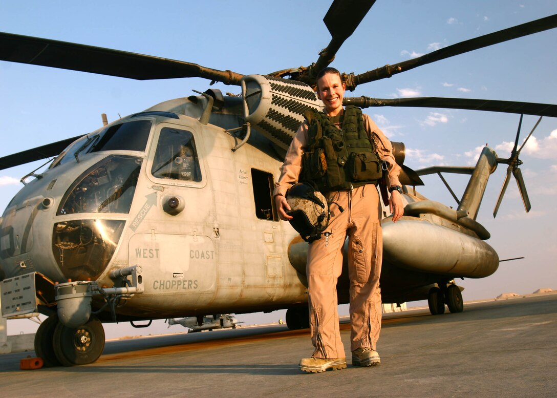 Navy Lt. Stacey R. Black stands in front of a CH-53E Super Stallion shortly before flight Aug. 20, at Al Asad, Iraq. Black is a flight surgeon for Marine Heavy Helicopter Squadron 361, Marine Aircraft Group 16 (Reinforced), 3rd Marine Aircraft Wing, and a native of Huntsville, Texas.