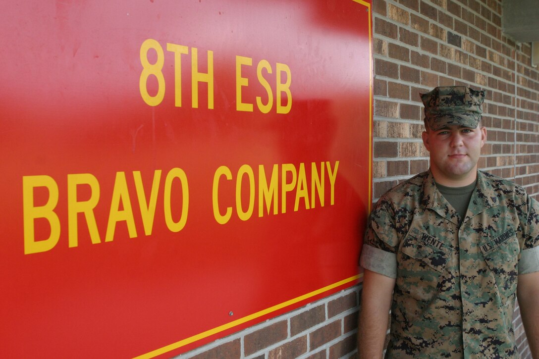 MARINE CORPS BASE CAMP LEJEUNE, N.C. (Aug. 21, 2006) - Corporal Brian N. Wente, a combat engineer with Company B, 8th Engineer Support Battalion, 2nd Marine Logistics Group, proudly stands next to his company sign Aug. 21. ?I?ll tell you right now, he?s the hardest working Marine in the platoon,? said 2nd Lt. Rano J. Mariotti, platoon commander, Company B, 8th Engineer Support Battalion, 2nd Marine Logistics Group. ?He?s always eager to get in there and do what he has to do to get the job done.?