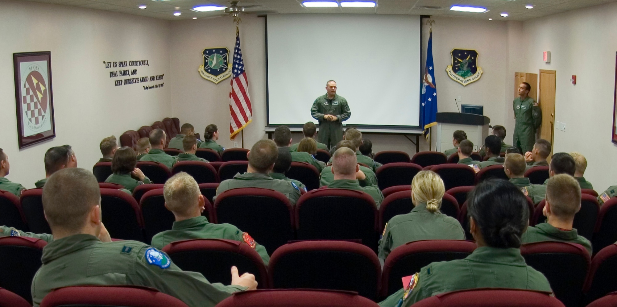 Lt. Col. Jed Davis addresses missile combat crewmembers from the 91st Space Wing Aug. 18 during a pre-departure briefing at Minot Air Force Base, N.D.  Following the briefing, the crews depart for their respective missile alert facilities scattered across the northwest part of the state where they monitor the Minuteman III missiles under their control.  Colonel Davis is the 741st Missile Squadron commander.  (U.S. Air Force photo/Master Sgt. Lance Cheung) 