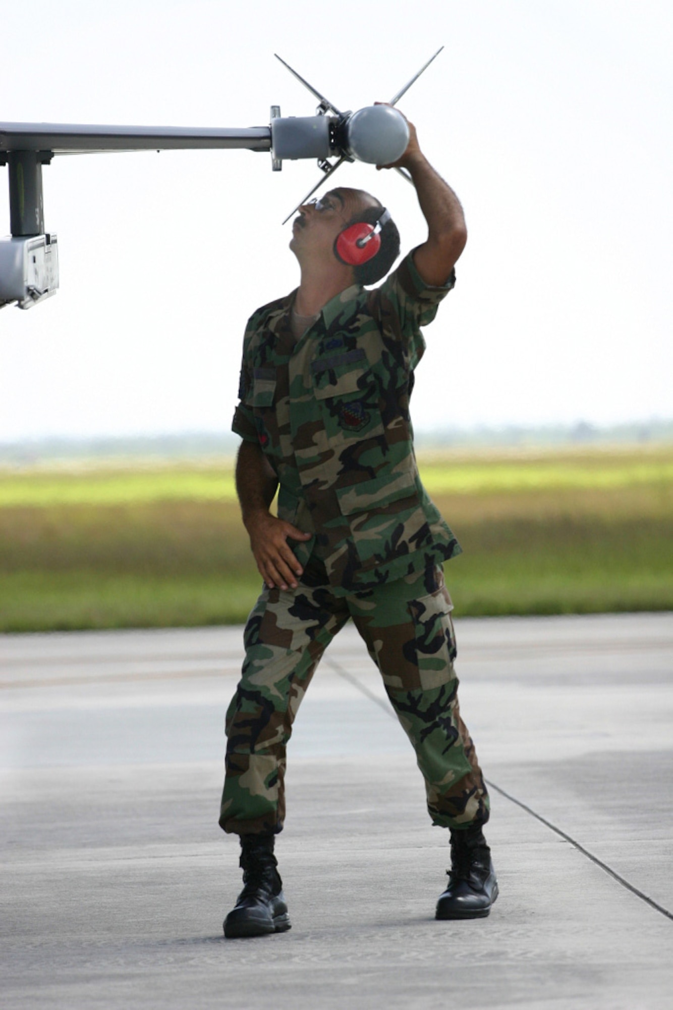 Tech. Sgt. Roberto Muniz checks the security setting of the missile launcher on an F-16 during end-of-runway inspection Aug. 11, here at Homestead Air Reserve Base, Fla. 482nd Fighter Wing pilots and maintainers headed to Hickam Air Force Base to train with the Hawaii Air National Guard in exercise Cactus Aloha. (US Air Force photo by Tech. Sgt. Bucky Parrish)