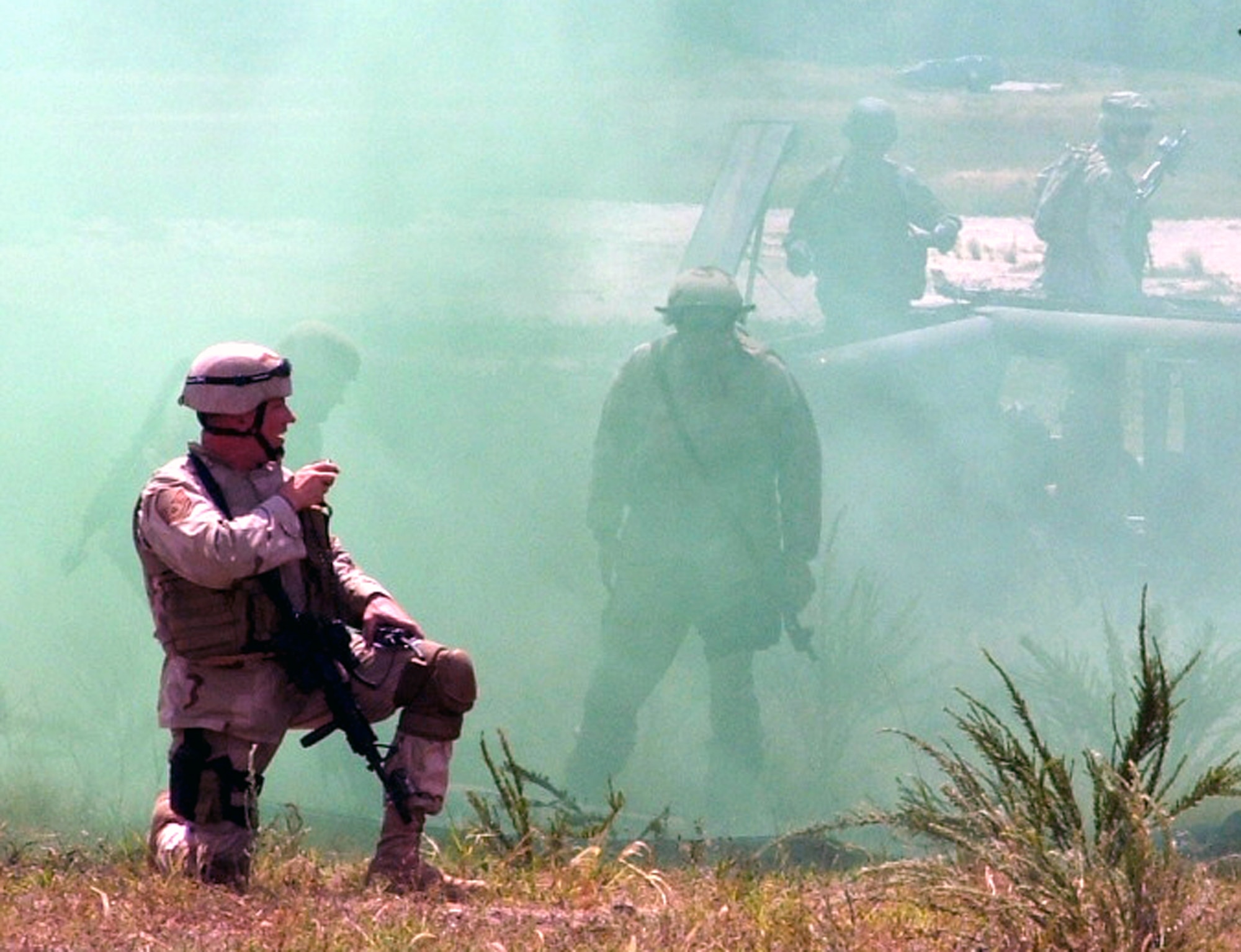 A student in the Phoenix Warrior 06-1 course calls for aid while his fellow security forces Airmen respond to an exercise medical emergency at Fort Dix, N.J., on Aug. 8. More than 90 Air Force security forces participated in the course to prepare for deployments. The course is taught by the Air Mobility Warfare Center's 421st Combat Training Squadron. (U.S. Air Force photo/Tech. Sgt. Scott T. Sturkol)