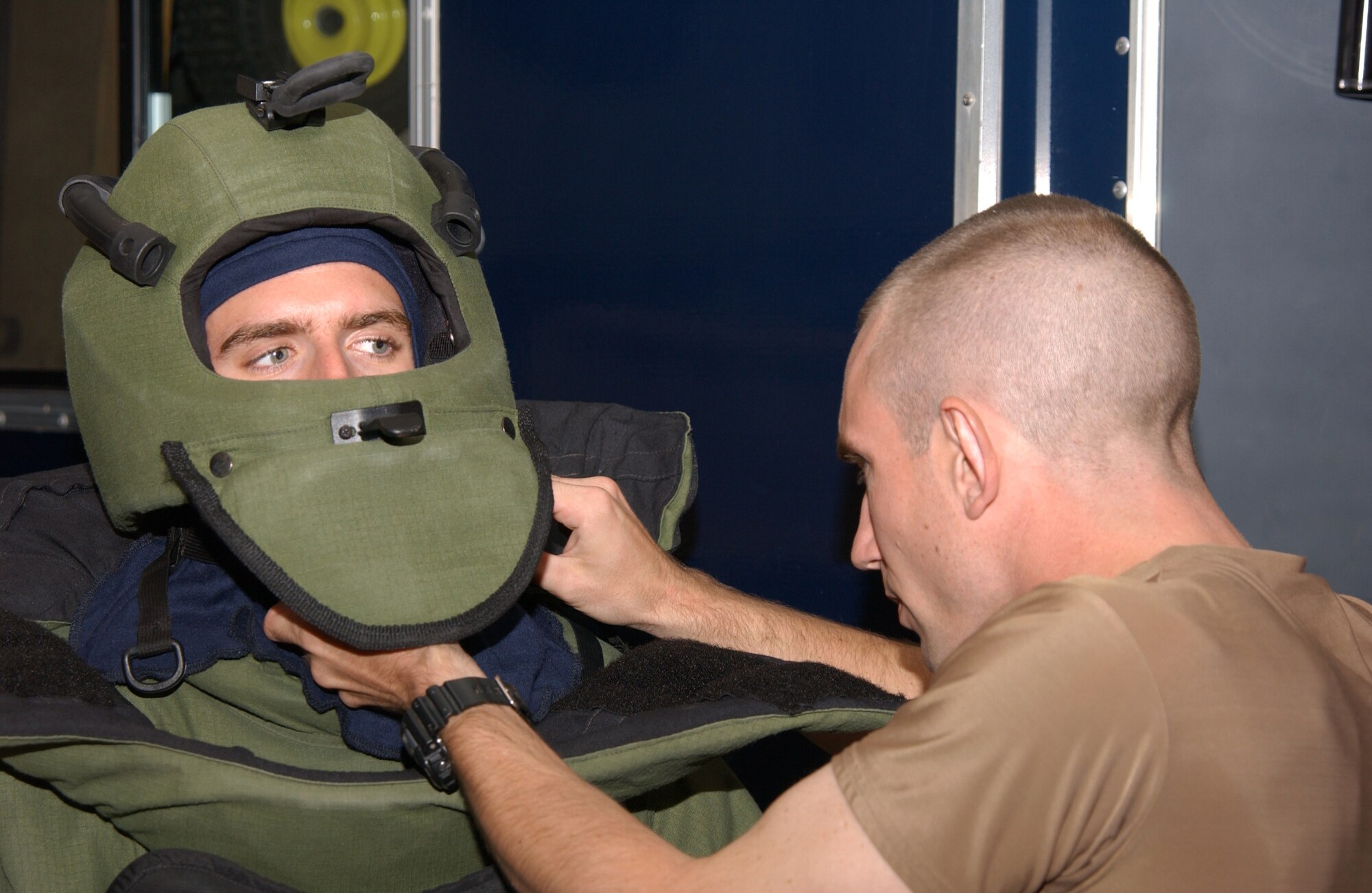 Staff Sgt. Kevin Hammer (right), an explosive ordnance disposal craftsman with the 39th Civil Engineer Squadron, adjusts the straps on Staff Sgt.Ryan Bobzin's, 39th CES explosive ordnance disposal journeyman, bio suit during a bioenvironmental exercise. (U.S. Air Force photo by Airman 1st Class Nathan Lipscomp)