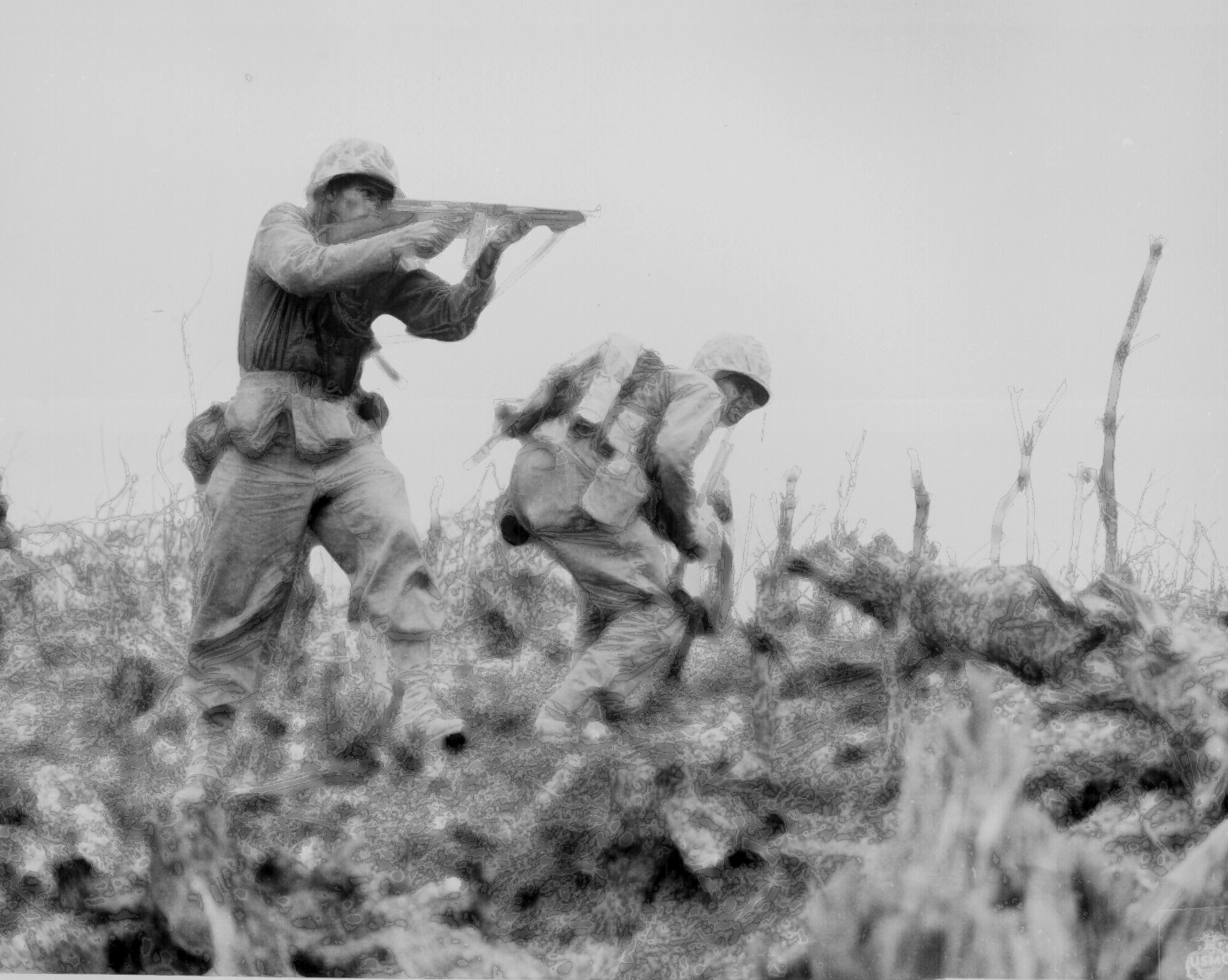 A Marine of the 1st Marine Division draws a bead on a Japanese sniper with his tommy-gun as his companion ducks for cover on the island of Okinawa, Japan. Back then, some battle-worn soldiers were said to be "shell shocked." These days, combat stress control teams battle combat-related stress on the front lines.  
S.Sgt. Walter F. Kleine, Okinawa.
