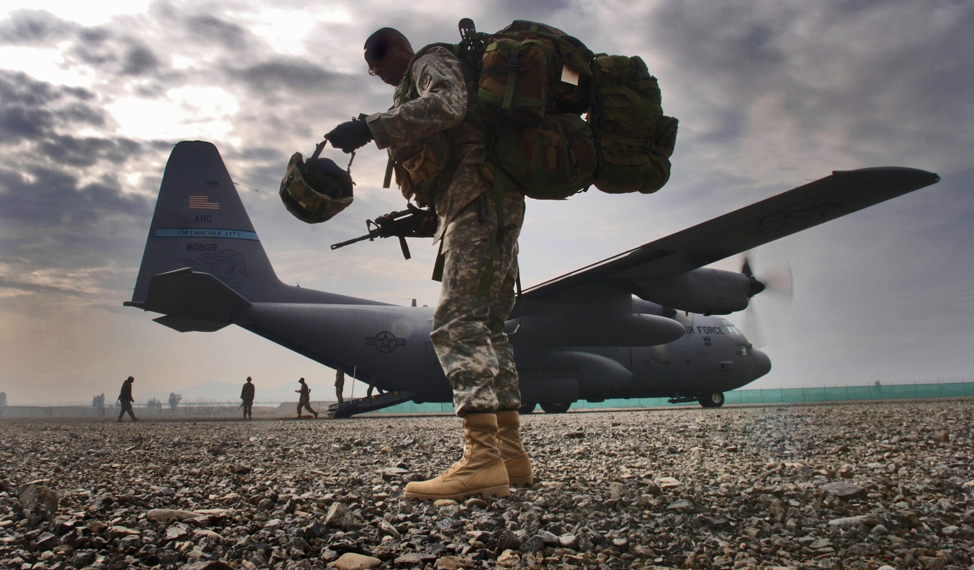 A soldier is last in line to board a C-130H2 Hercules aircraft here for a flight to Forward Operations Base Salerno, Afghanistan, on March 8, 2006. It's at FOBs like Solerno that Combat Stress Control teams deploy in their battle against the stresses of war. (Air Force photo by Master Sgt. Lance Cheung, U.S. Air Force.)