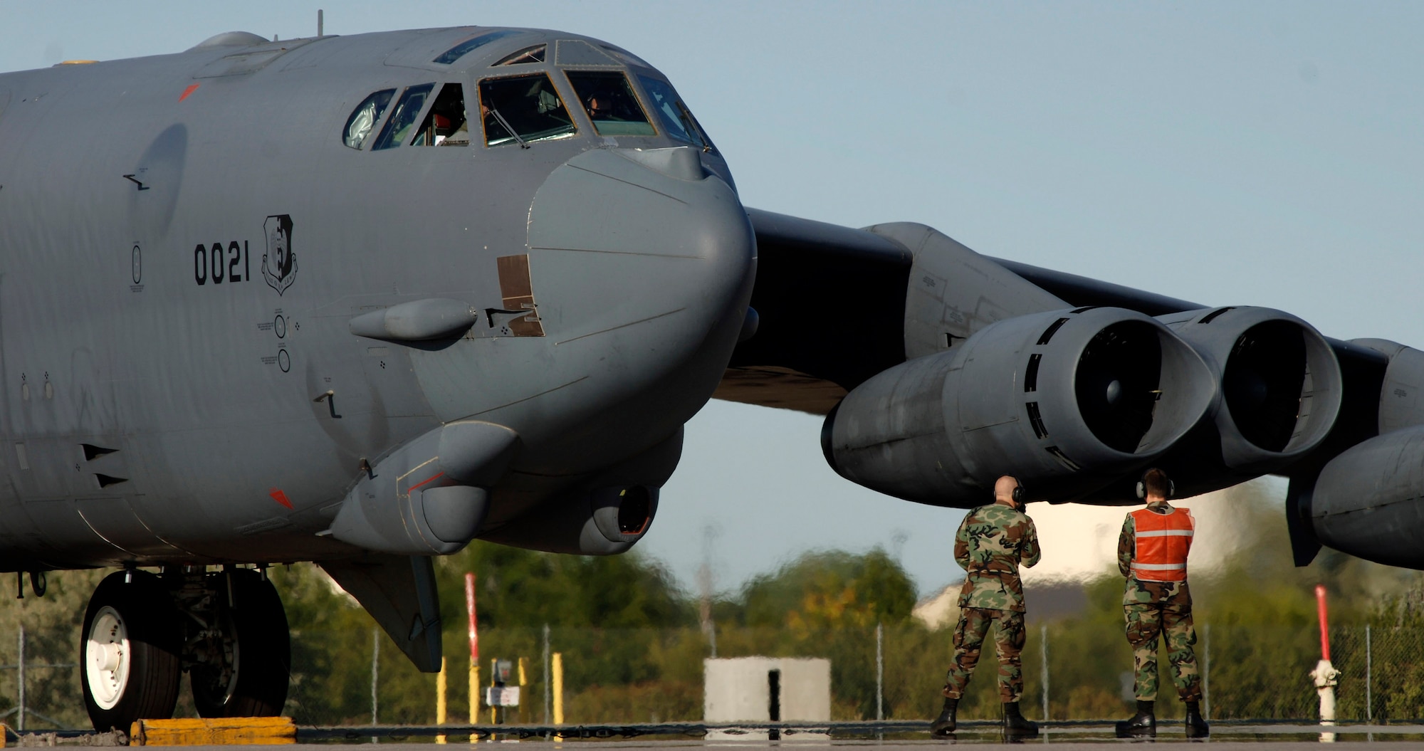 Senior Airman Nathan Jacobson (left) and Airman 1st Class Tyler Lyght monitor the engine start and run-up of a B-52 Stratofortress at Minot Air Force Base, N.D., Aug. 21. The Airmen are crew chiefs with the 5th Aircraft Maintenance Squadron at Minot AFB. (U.S. Air Force photo/Master Sgt. Lance Cheung)