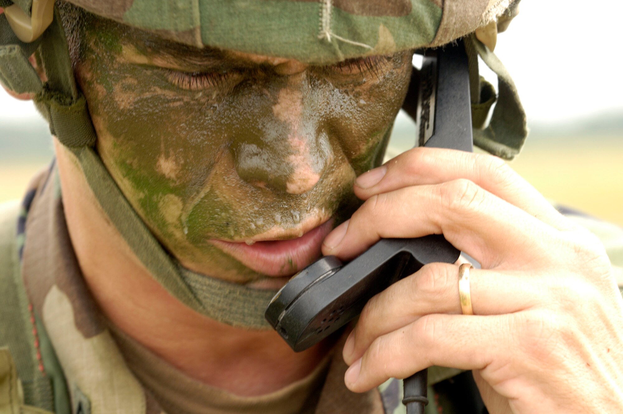Army Master Sgt. Chad Etzel communicates his location to higher headquarters Aug. 21 during a joint forcible entry exercise with the Air Force on the East Coast. The JFEX training exercise is designed to validate combat readiness, leadership, planning staff, aircrews and ground forces in joint airborne warfighting capabilities through integrated scenario-based training operations. Sergeant Etzel is assigned to the 20th Engineer Battalion at Fort Bragg, N.C. (U.S. Air Force photo/Tech. Sgt. Denise Rayder)